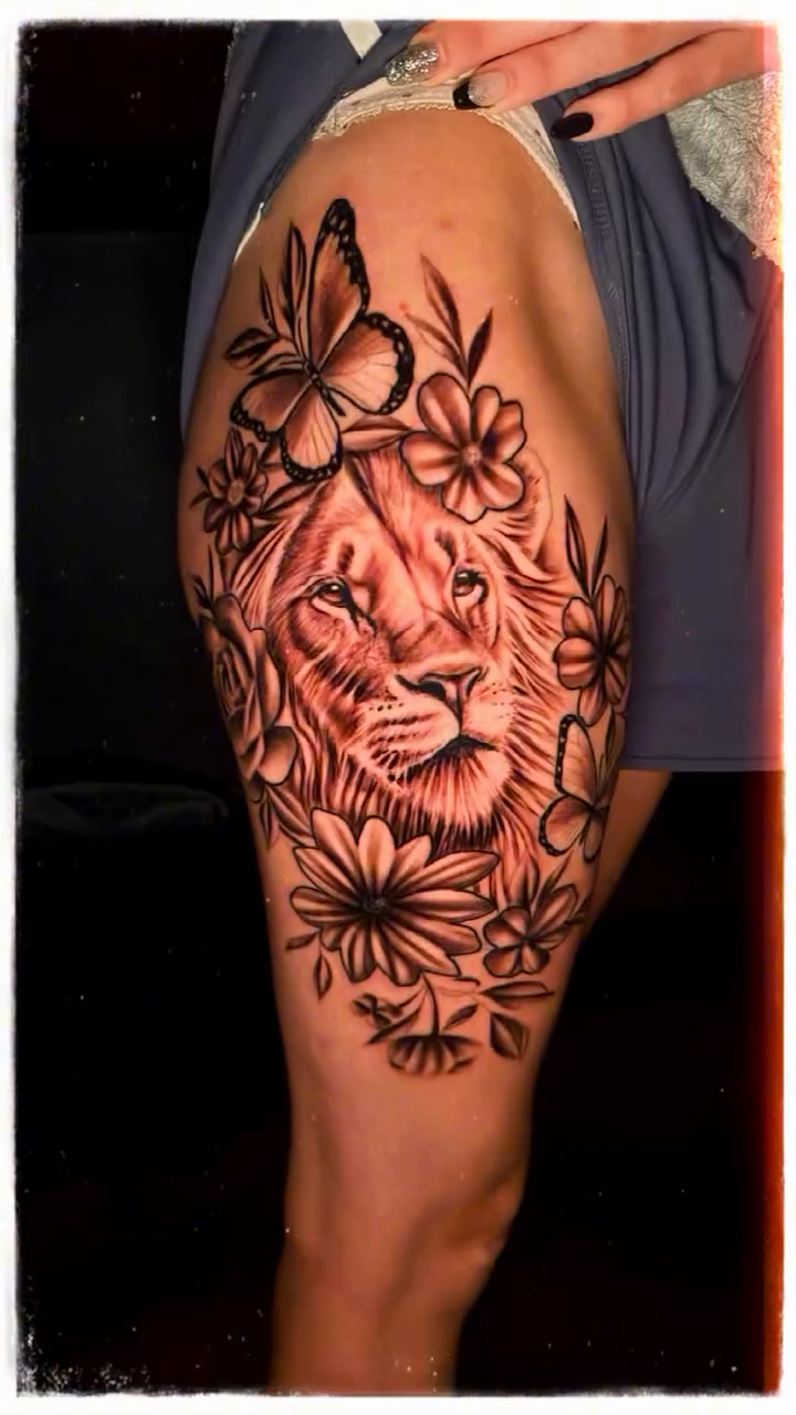 Lion with flowers realism tattoo by Jacob Martin, Toledo, Ohio