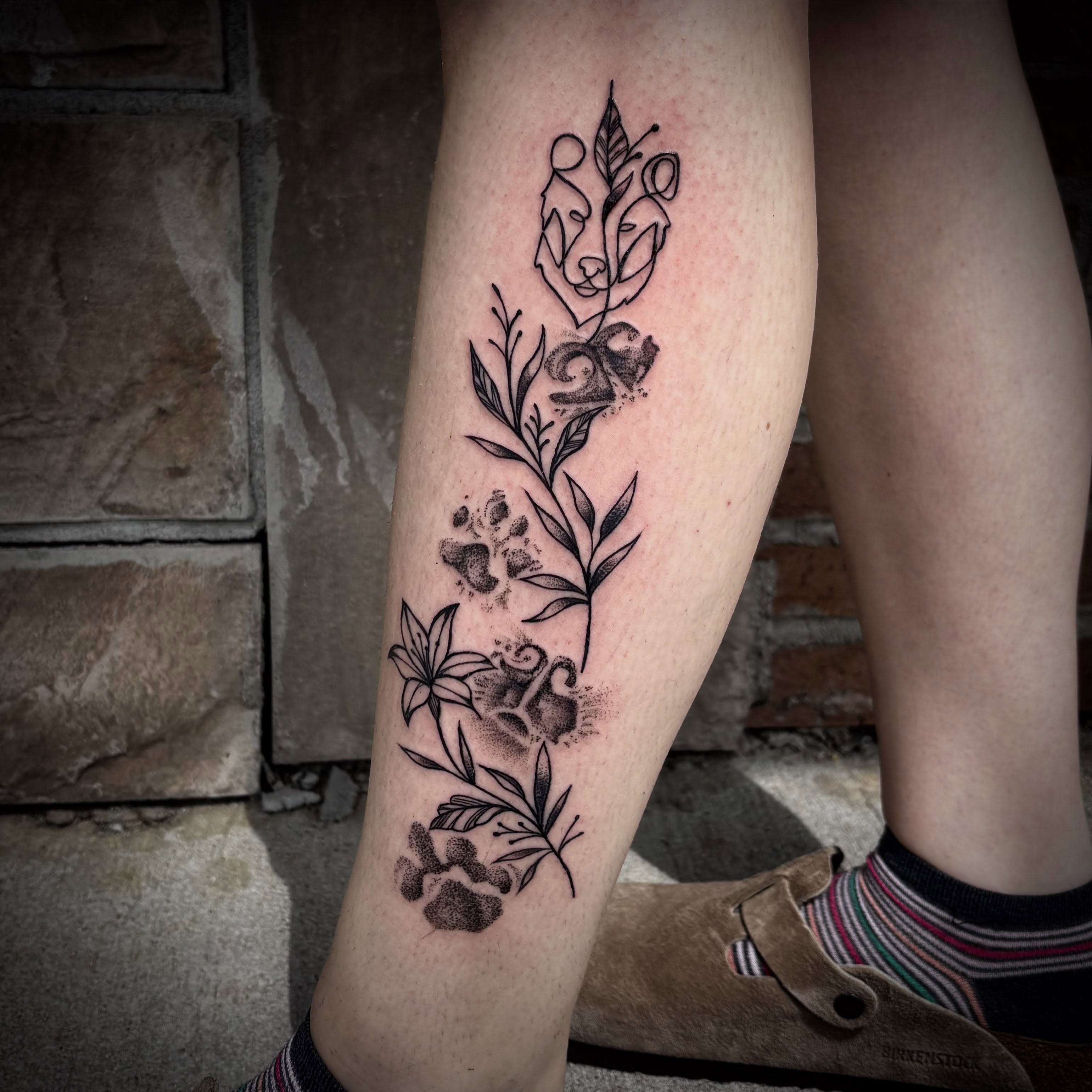 Wolf and floral dotwork tattoo on the calf by π΅πππππ