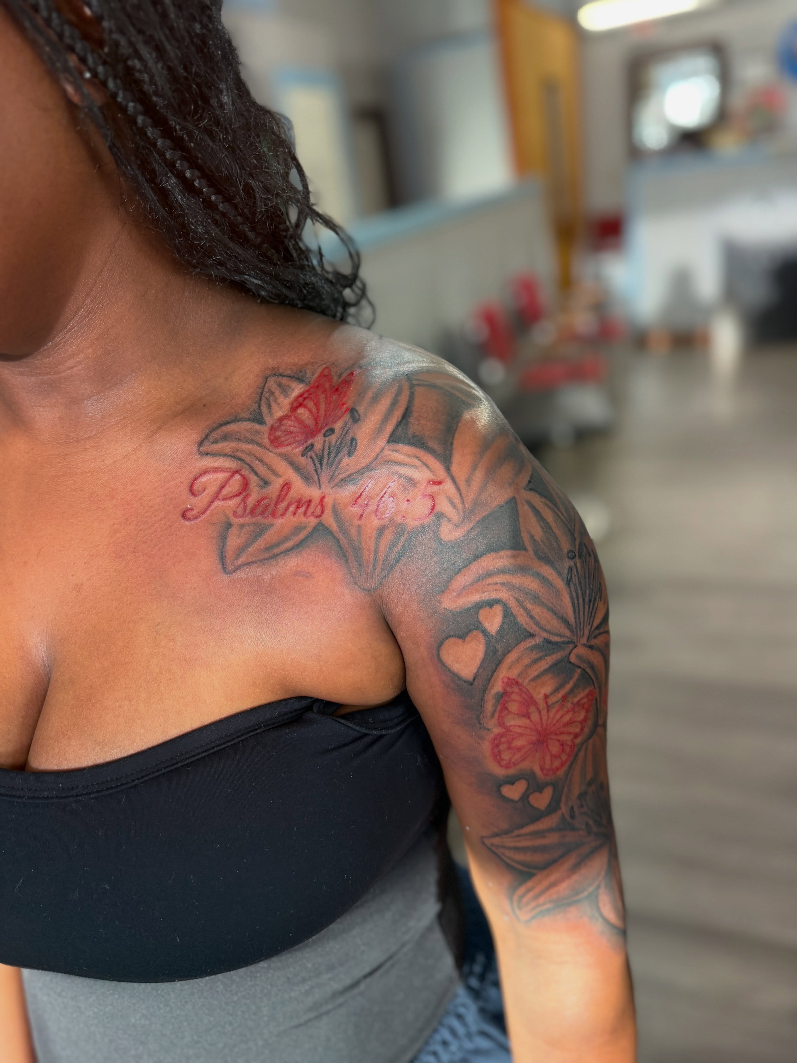 Lilies and butterfly black and grey tattoo on the shoulder by JAE, Shreveport, Louisiana