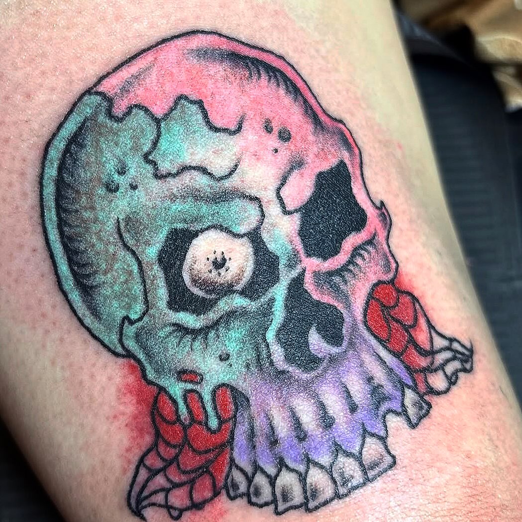 Skull dotwork tattoo on the thigh by Visionary Tattoos