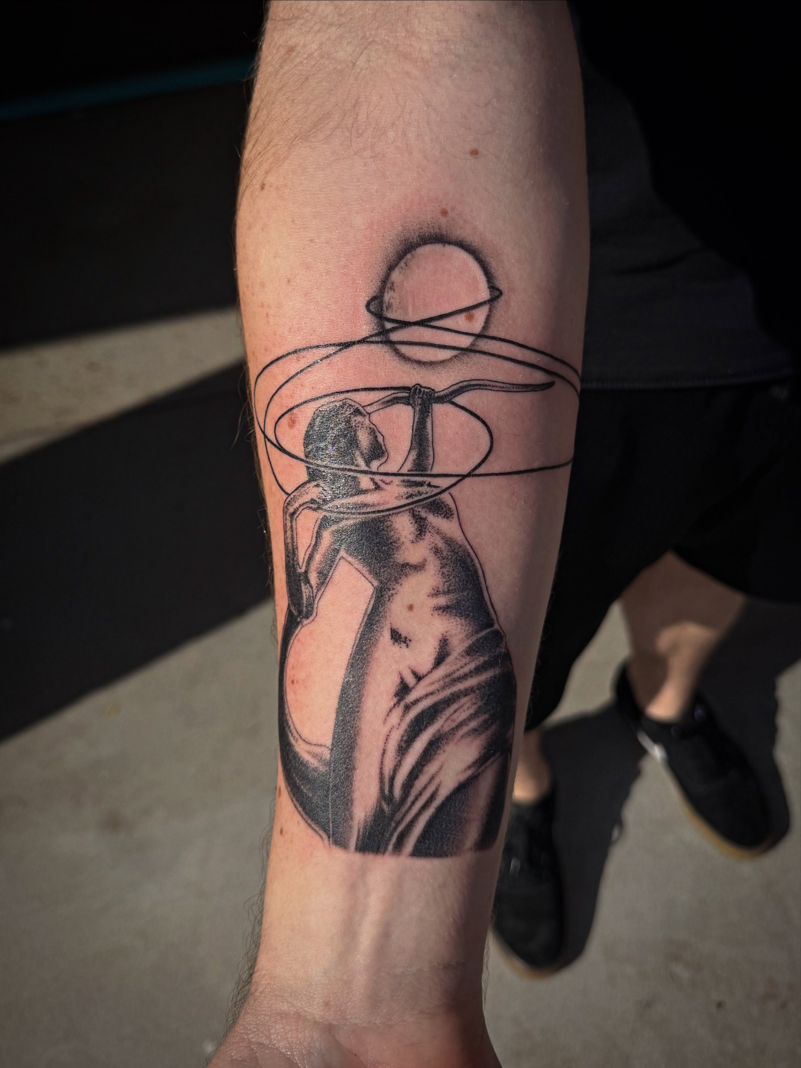 Dancer with hoops realism tattoo on the forearm by McKenna Hughes