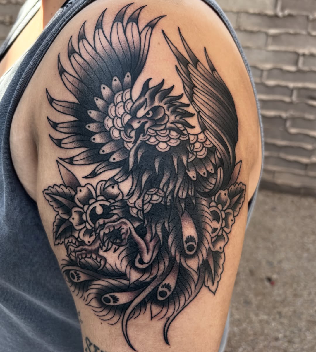 Phoenix black and grey tattoo on the shoulder by Allyson Monique