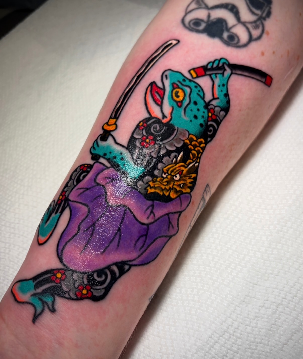 Gecko and demon American traditional tattoo on the forearm by Mickey Putillo, Charlotte, North Carolina