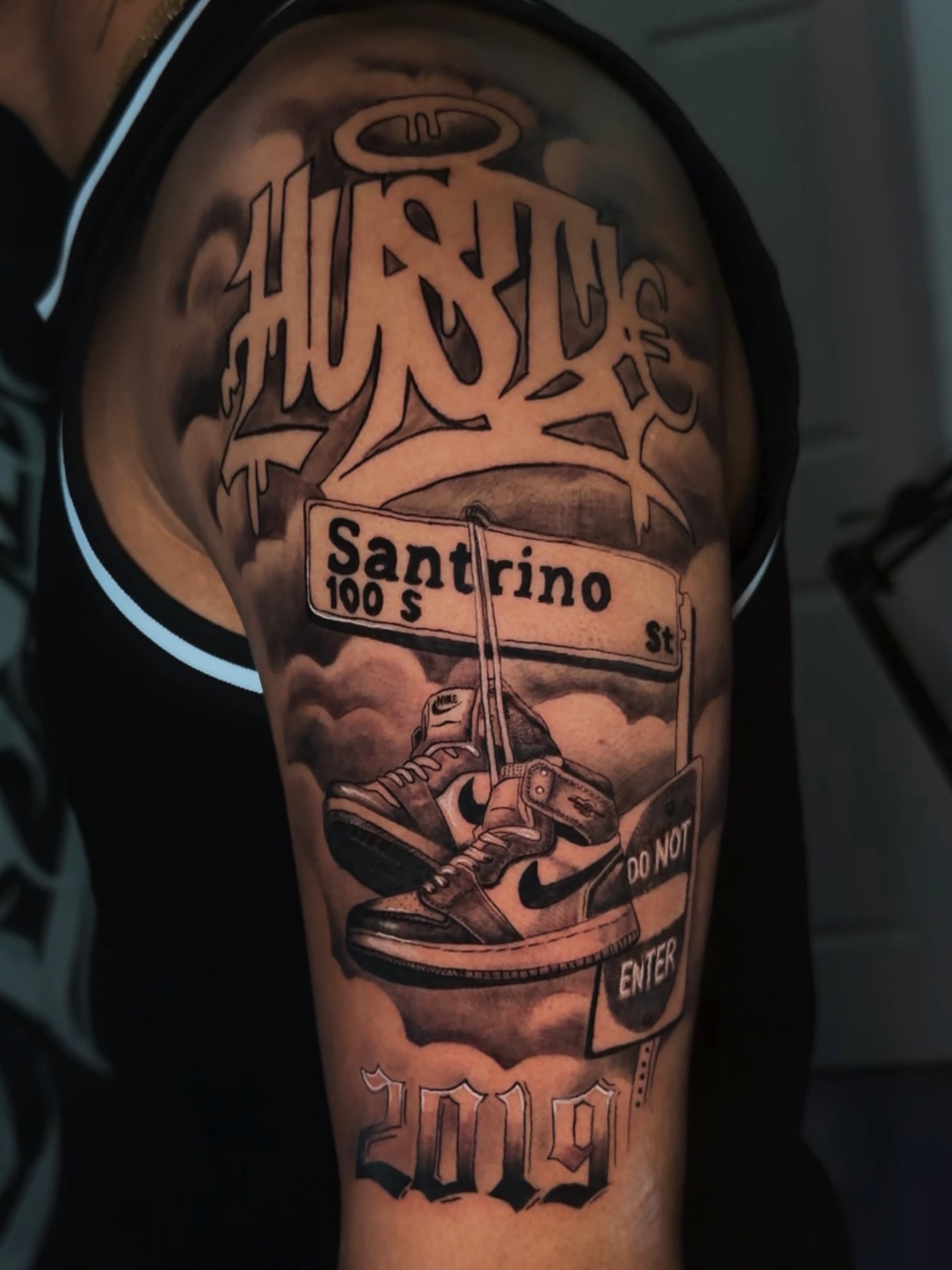 Street sign and sneakers realism tattoo on the forearm by 🐺