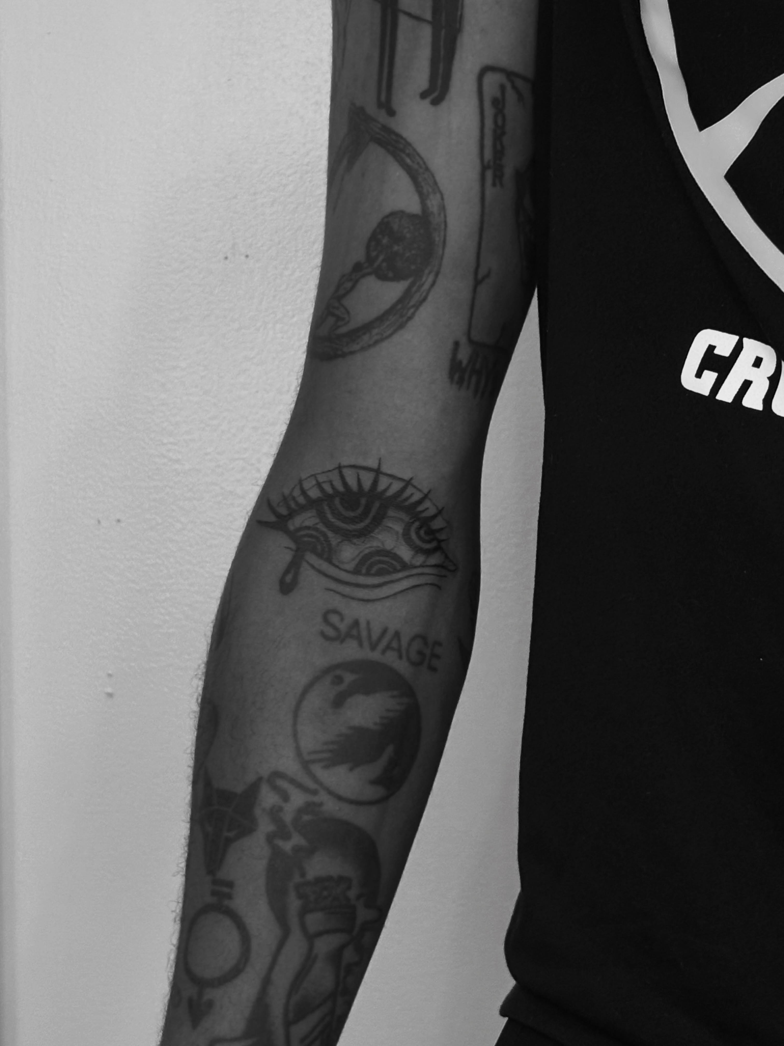 Eye black and grey tattoo on the forearm by Sarah