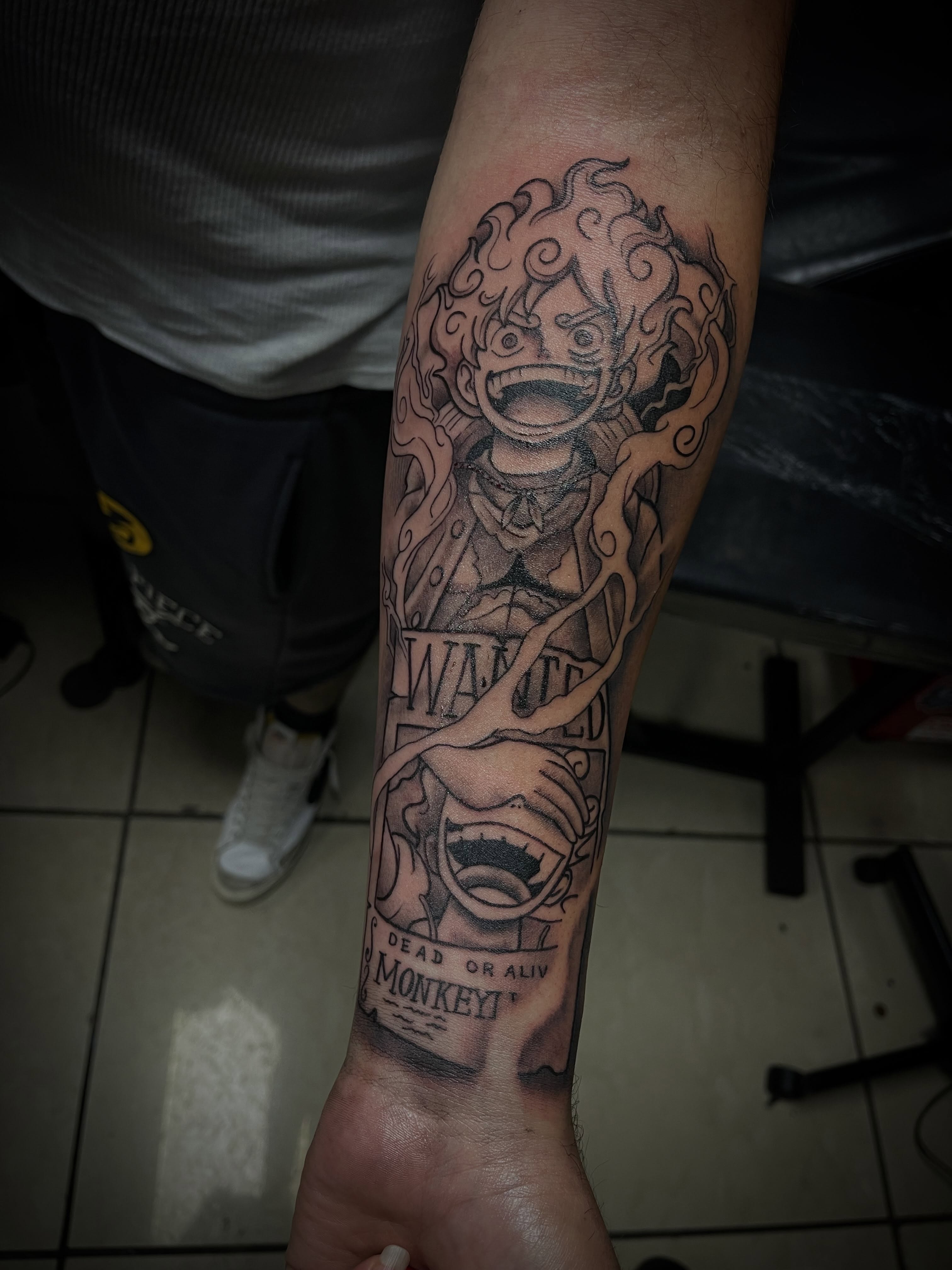 Monkey D. Luffy anime tattoo on the forearm by Chris Torres