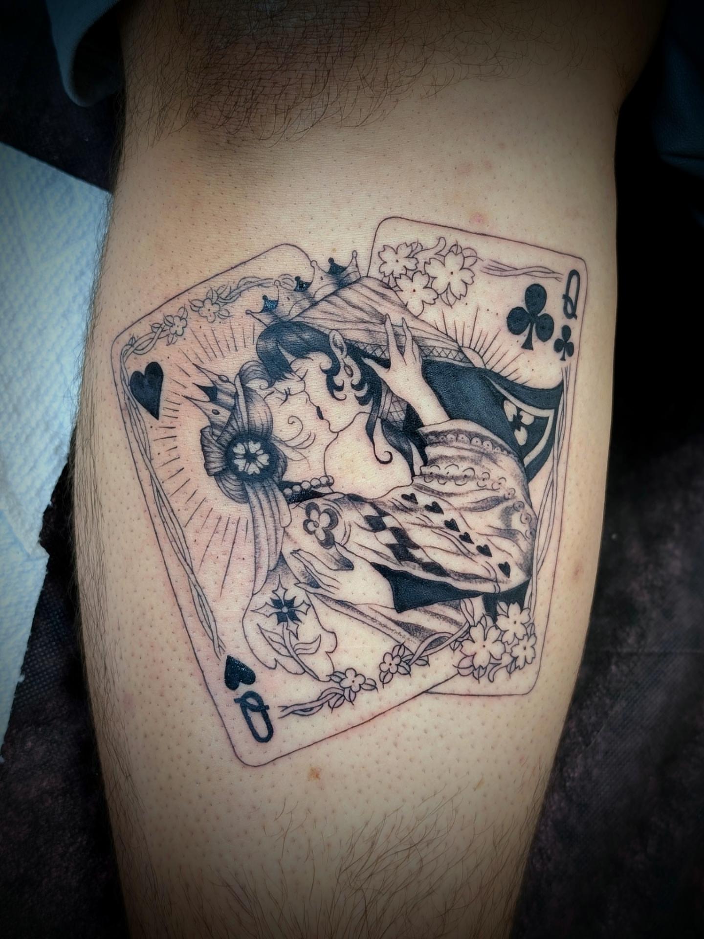 Playing card black and grey tattoo on the thigh by Rhiannon