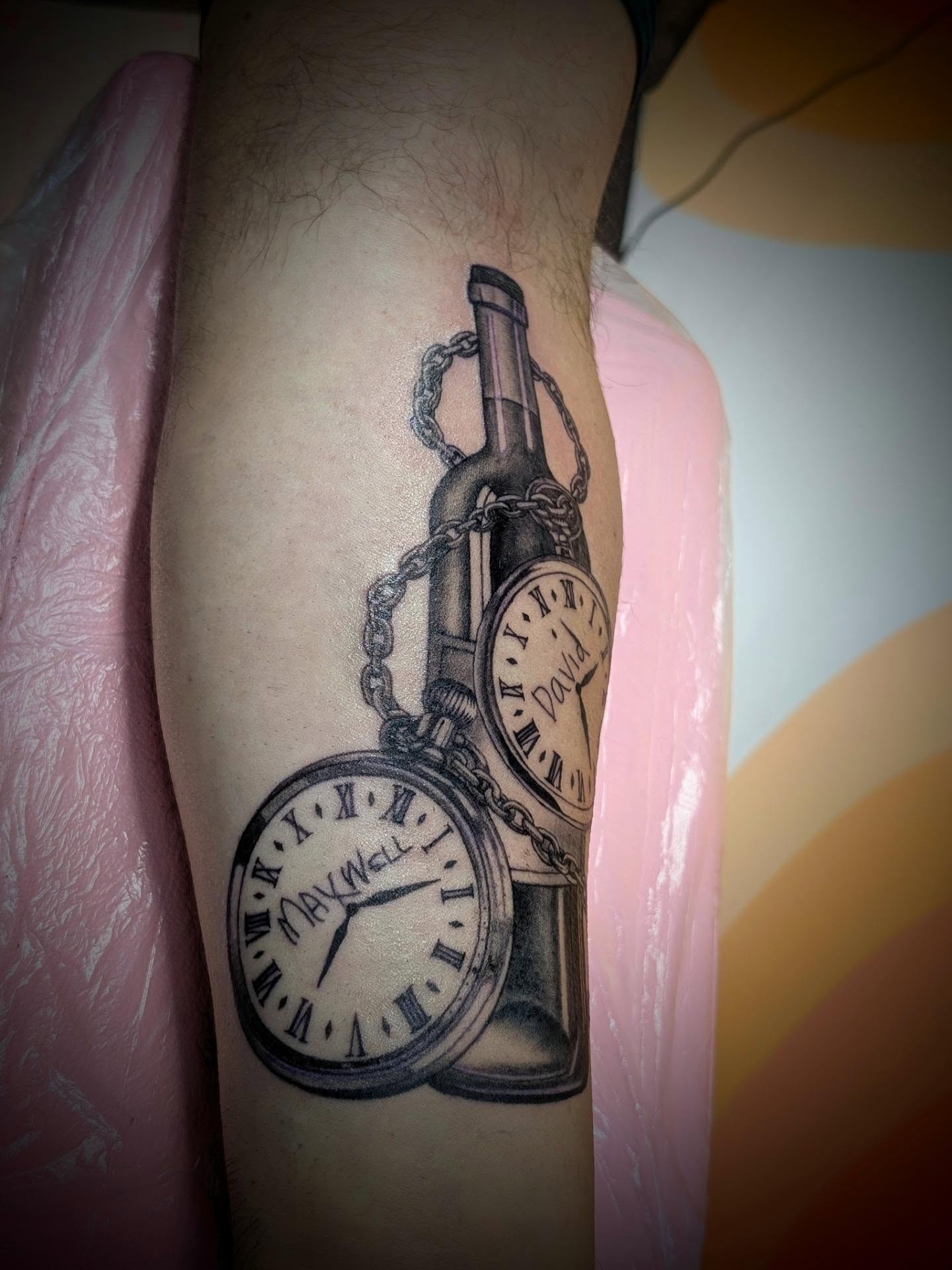 Pocket watch and bottle realism tattoo on the forearm by Rhiannon