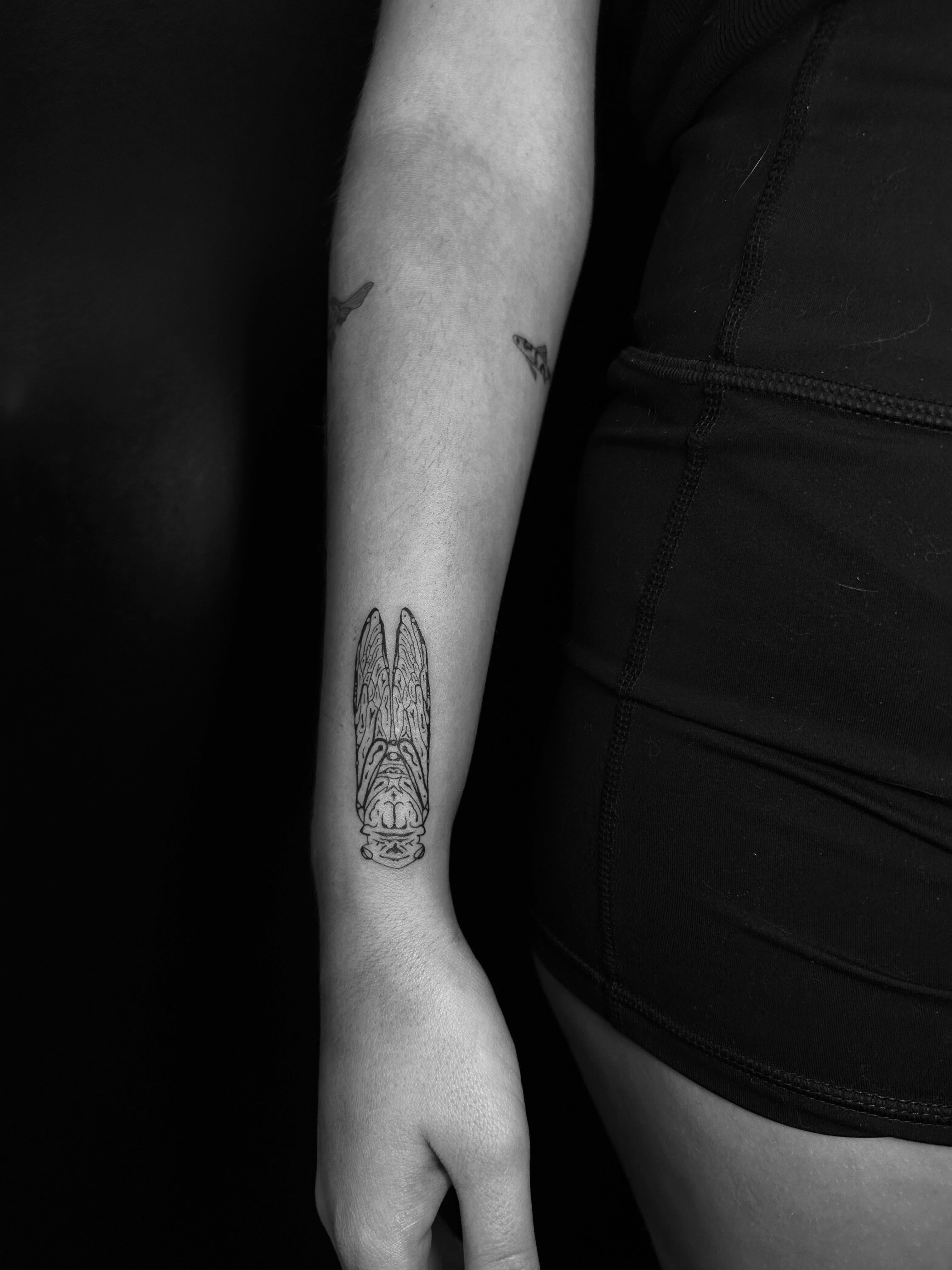 Angel wings black and grey tattoo on the forearm by L i v π Tattoo Artist. AMITY TATTOO