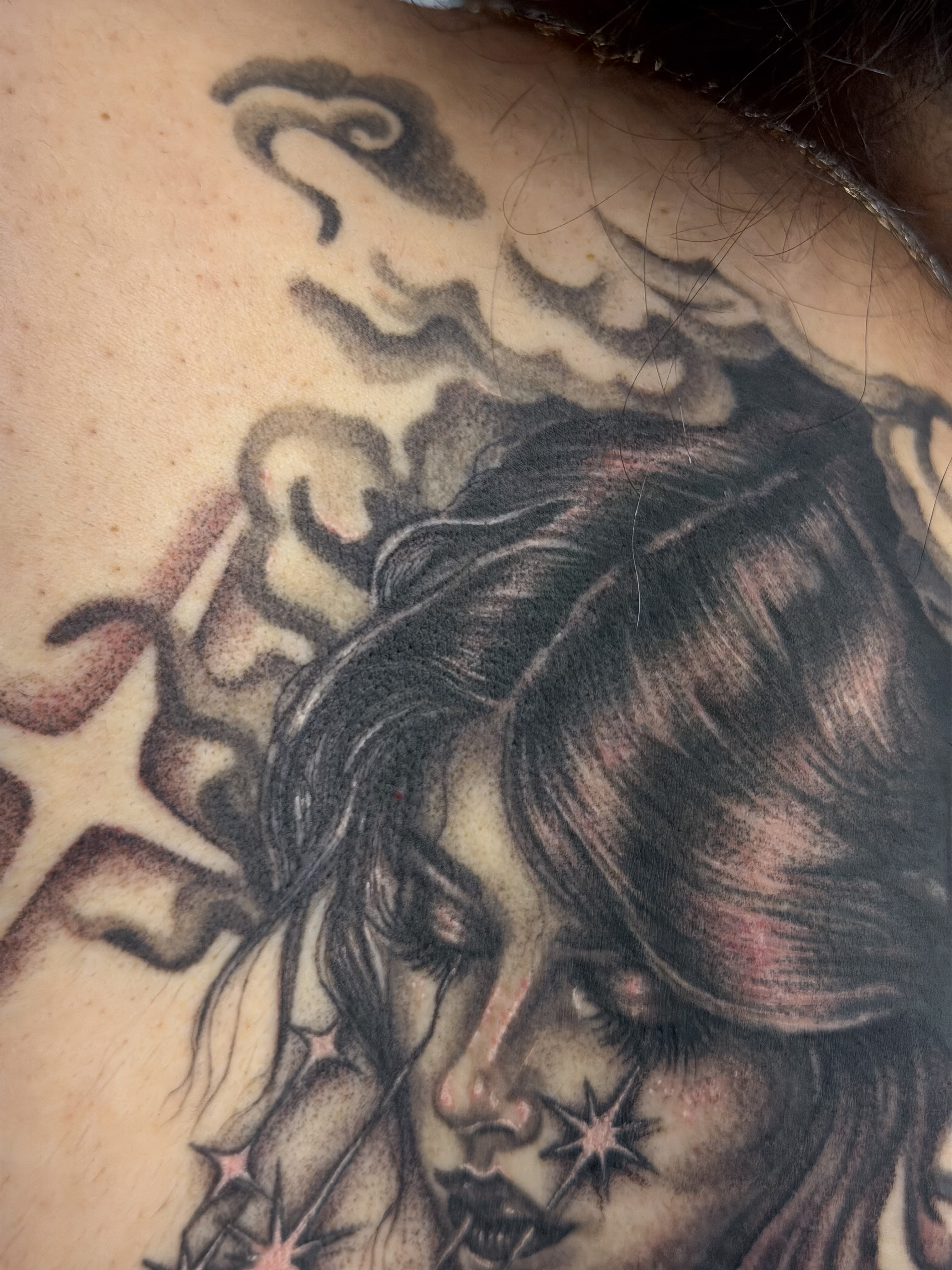 Woman with stars realism tattoo on the neck by Yvonne