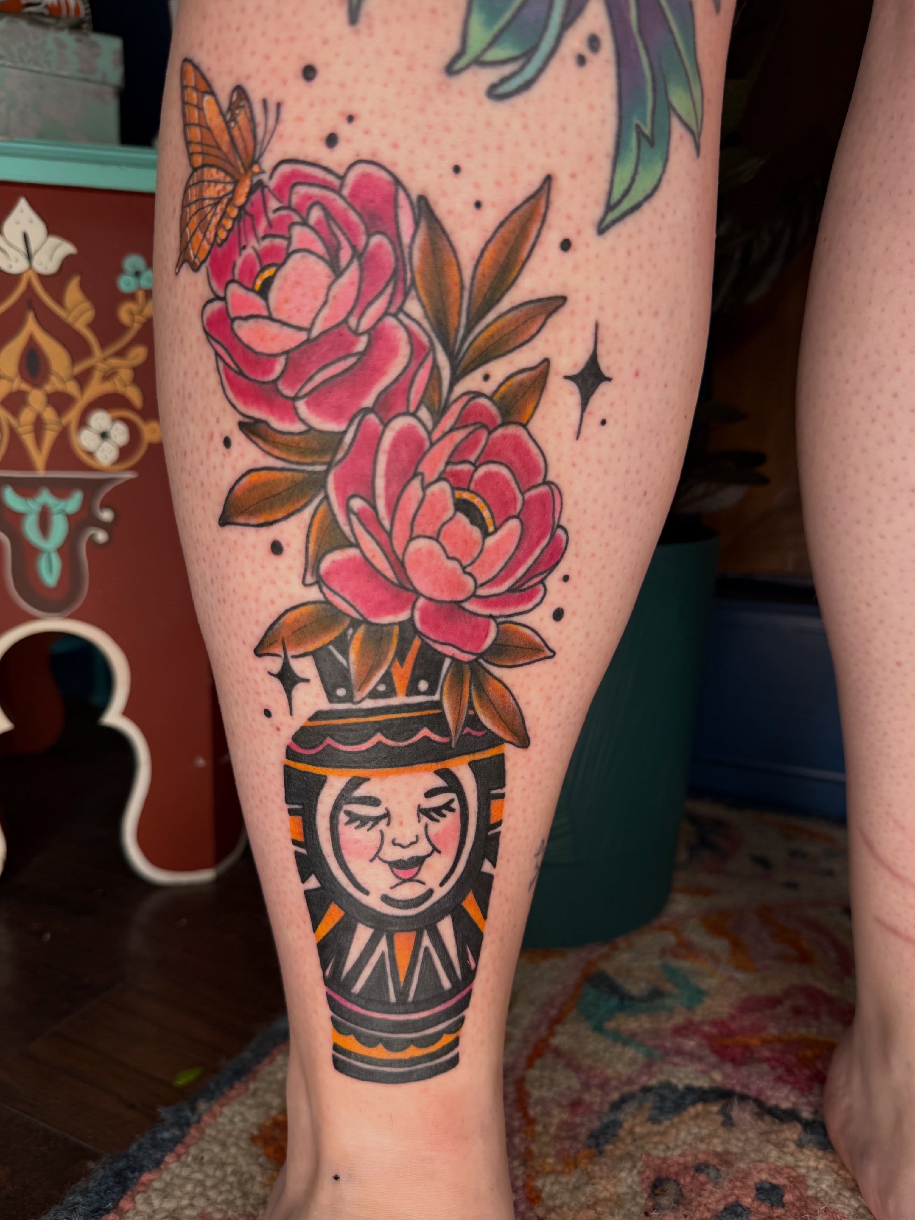 Peony vase American traditional tattoo on the calf by AJ Jensen