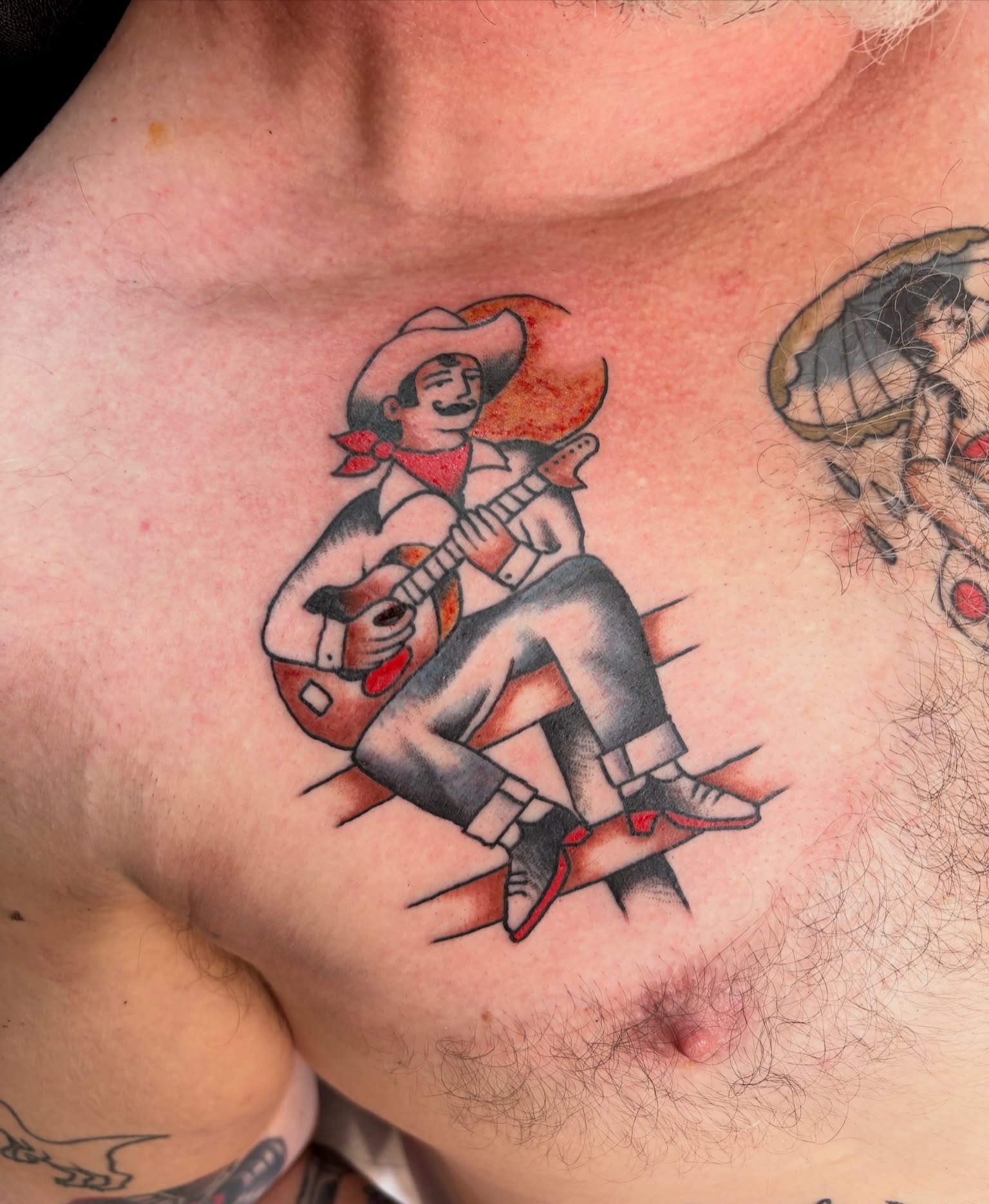 Musical mariachi American traditional tattoo on the chest by Sammy Tattoo, Austin, Texas