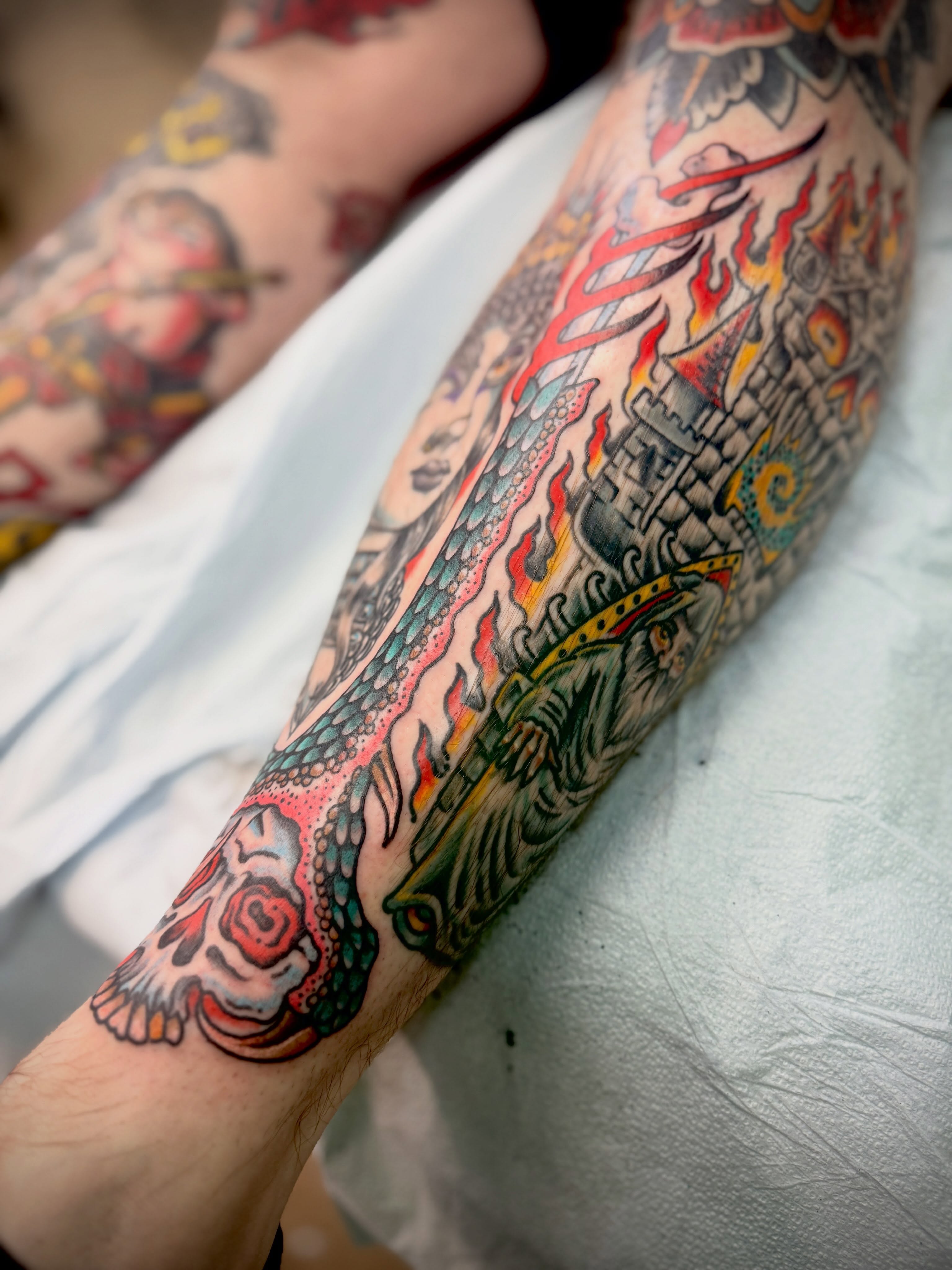 Skull and dragon American traditional tattoo on the forearm by Austin Liebst, Wichita, Kansas