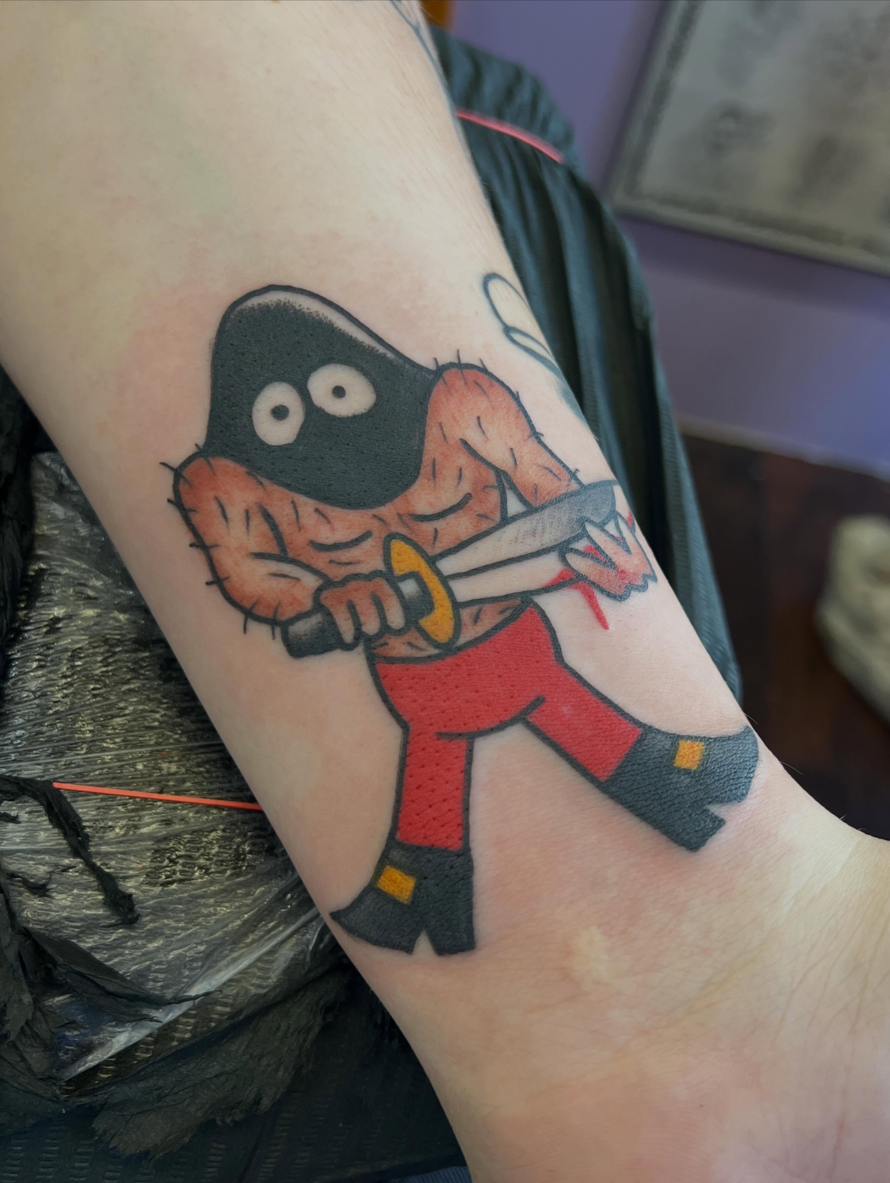 Clown with knife American traditional tattoo on the forearm by Mat Helton, Fairborn, Ohio