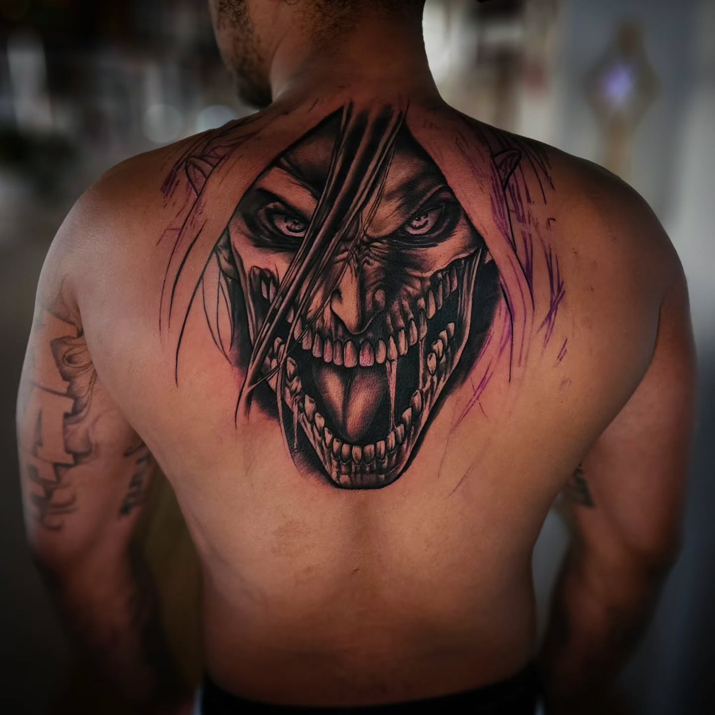 Demon face dark realism tattoo on the back by Justin J-rust Smith