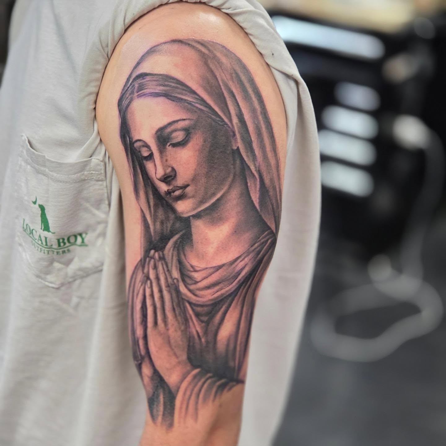 Praying woman realism tattoo on the shoulder by Robert Glover
