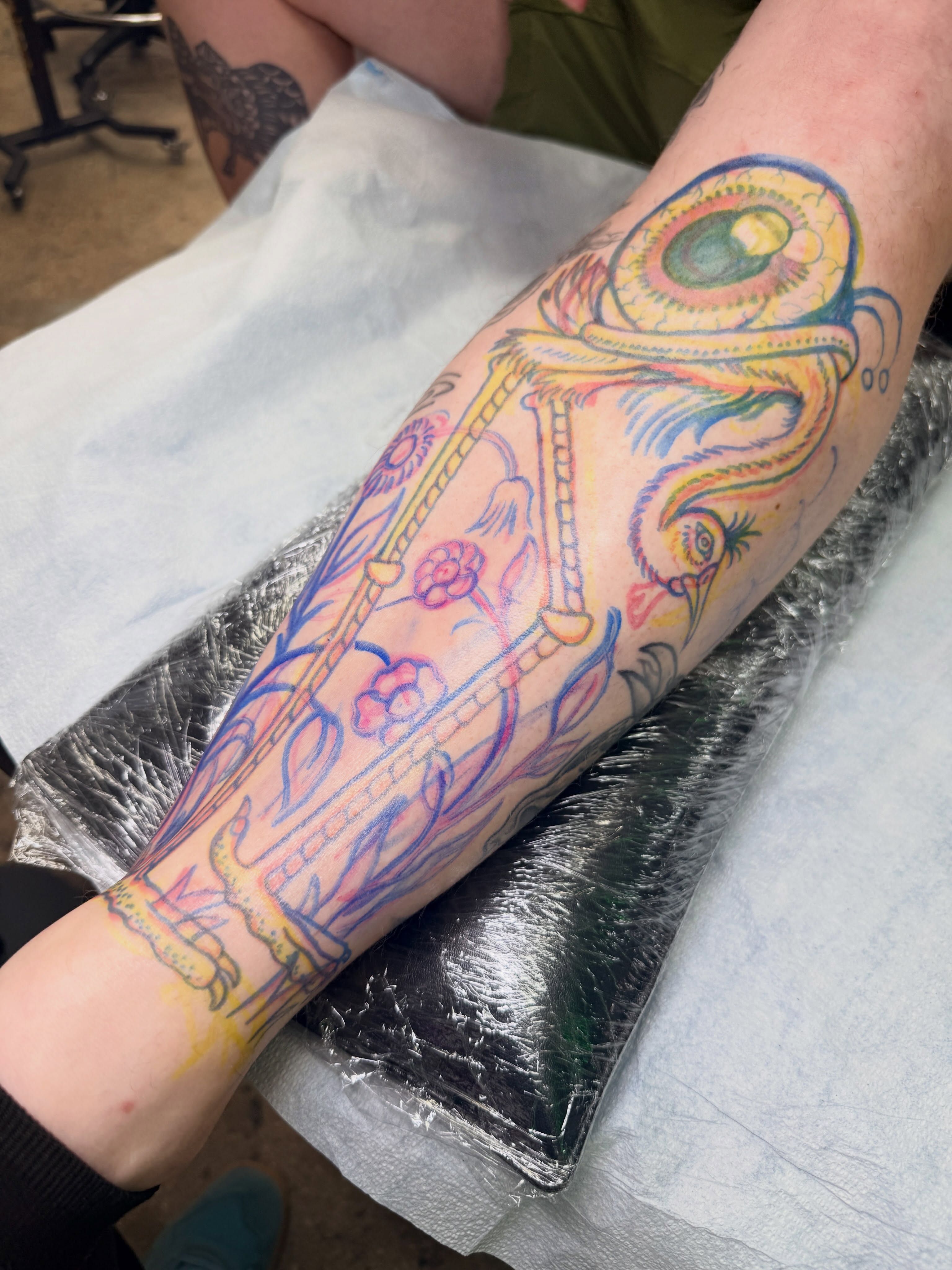 Floral and dragon new school tattoo on the forearm by Austin Liebst, Wichita, Kansas
