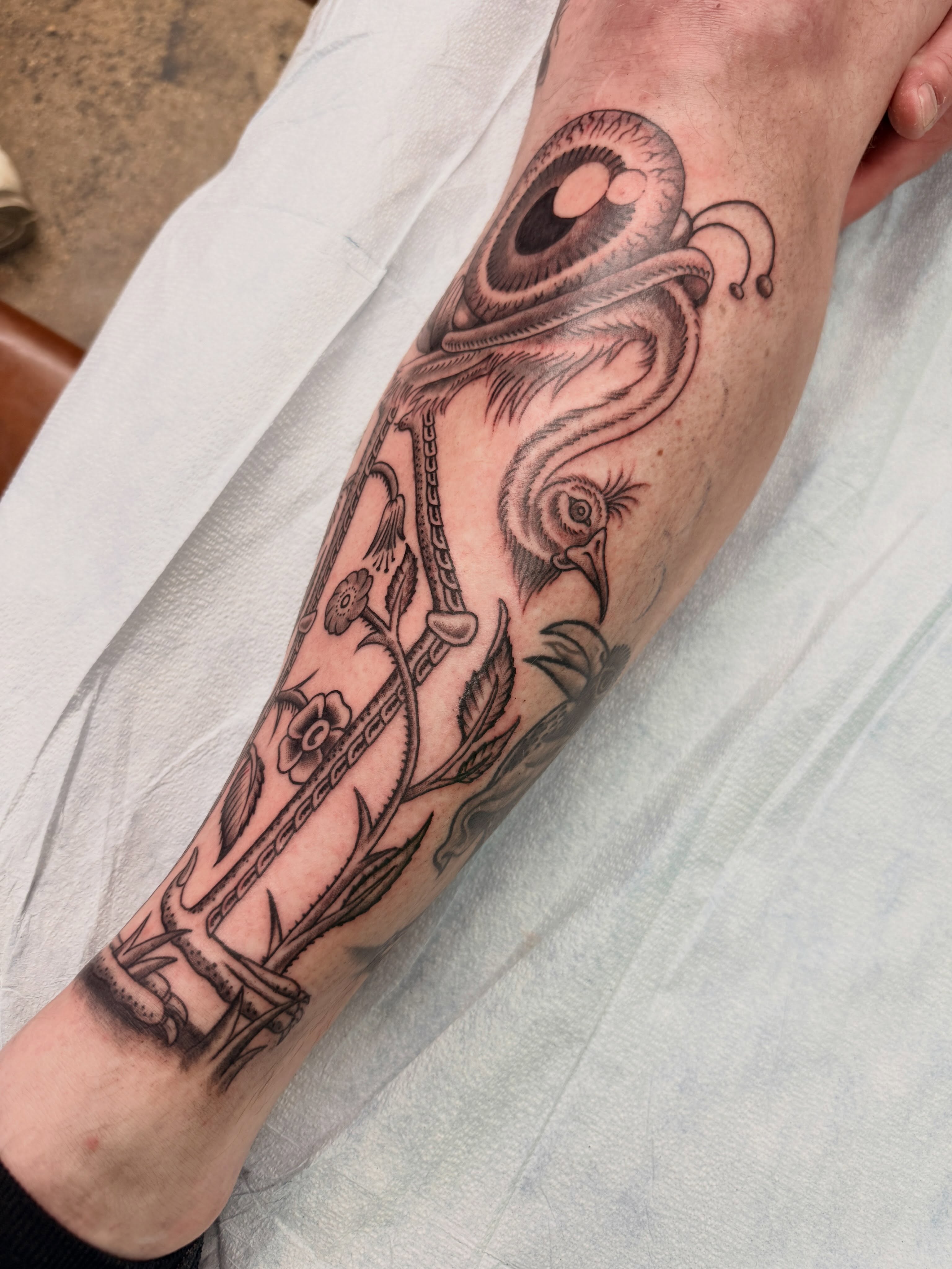 Octopus and ship realism tattoo on the forearm by Austin Liebst, Wichita, Kansas