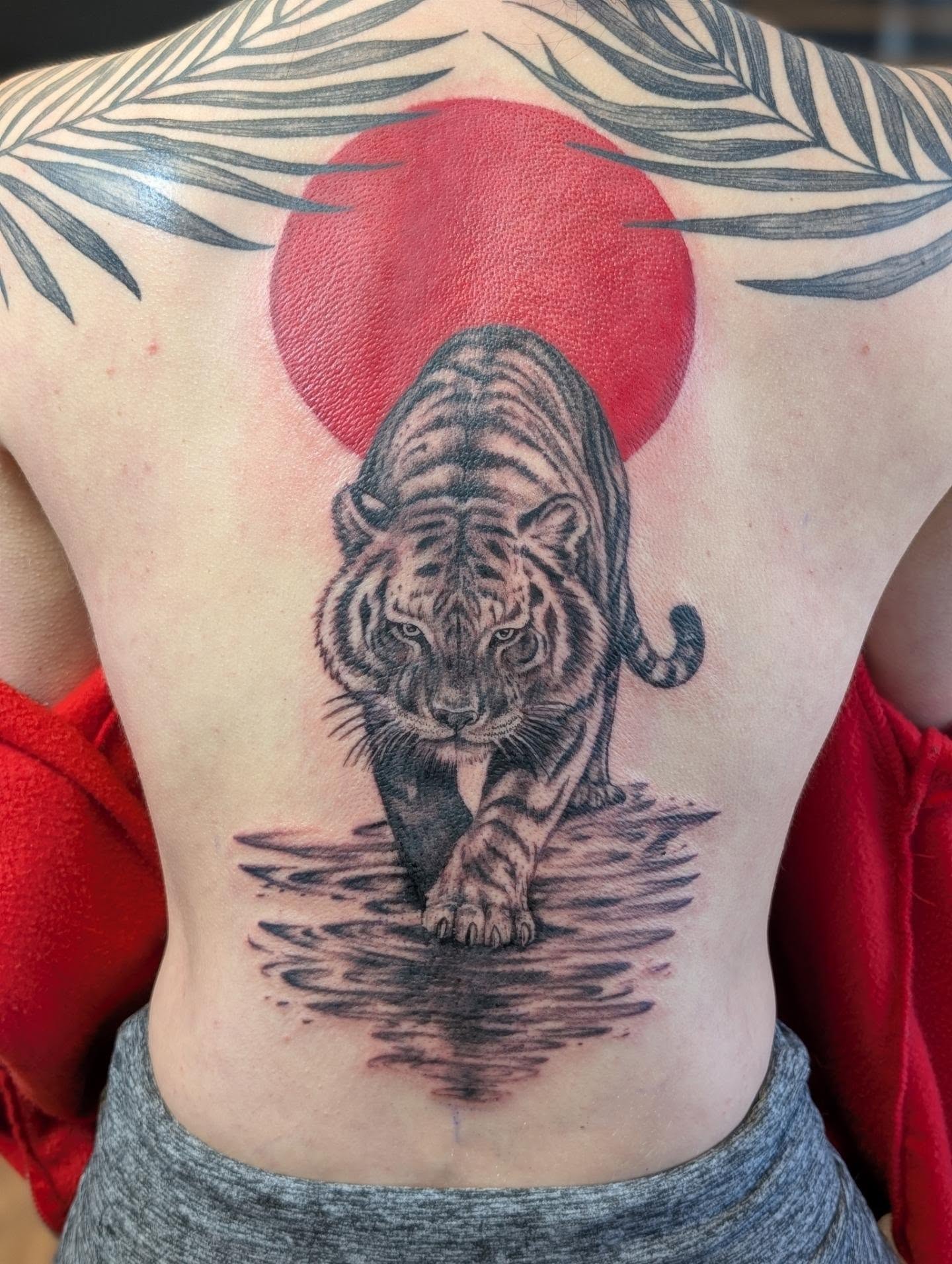Tiger realism tattoo on the back by Chad Nuber