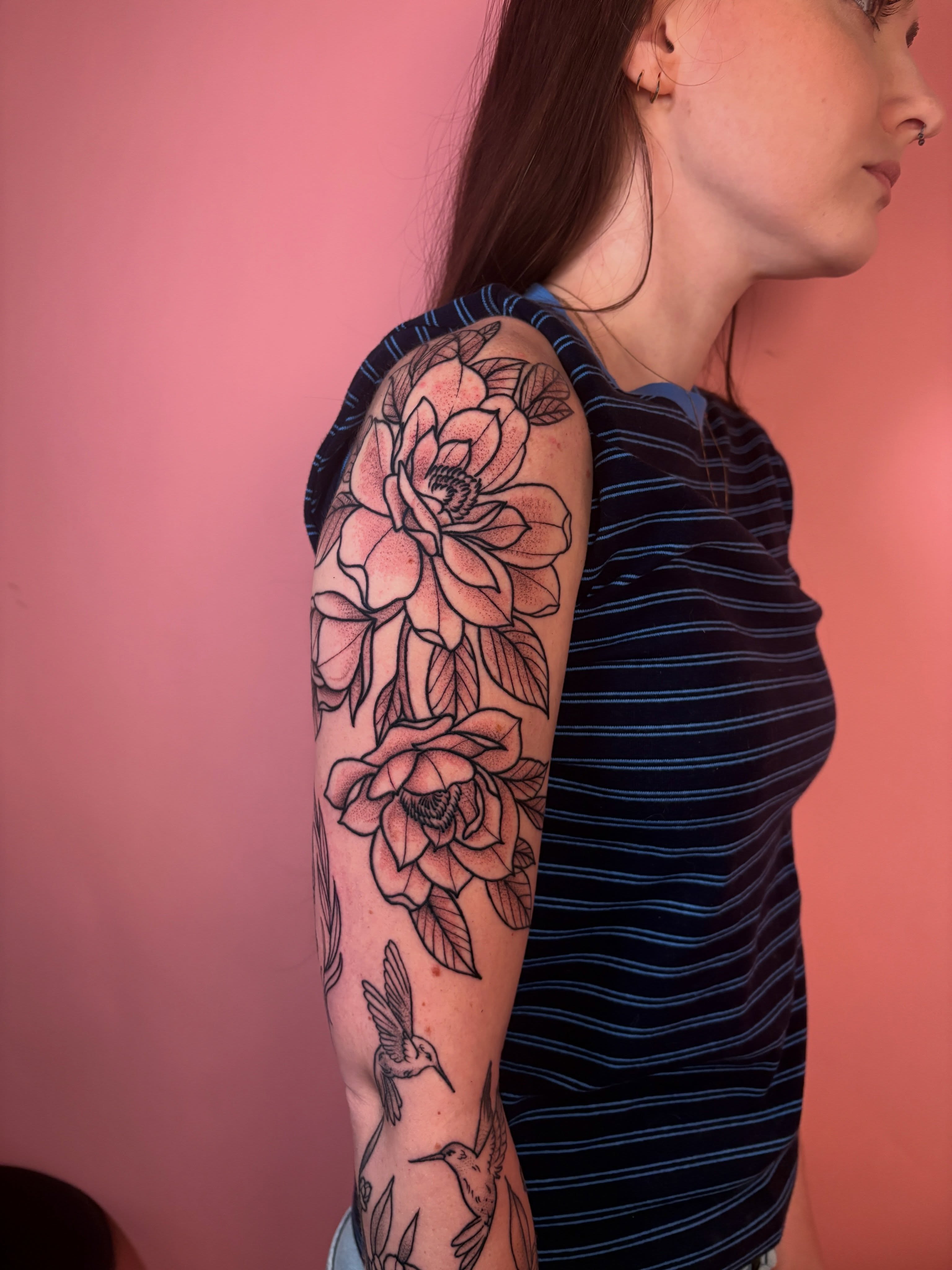 Lotus flowers and hummingbirds geometric tattoo on the upper arm by Car🦋🌈 Dallas Tattoo Artist💖