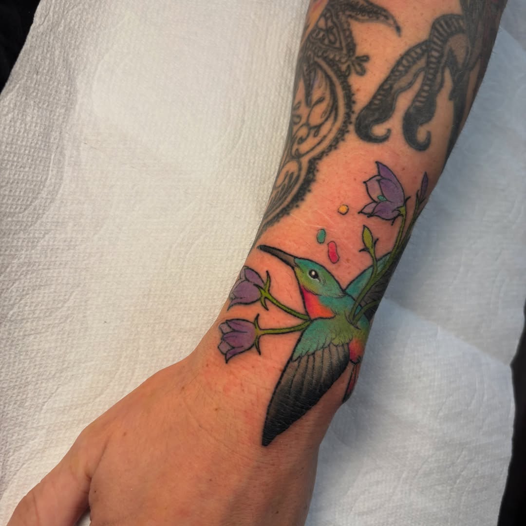 Hummingbird and flowers new school tattoo on the forearm by ✨REiD✨