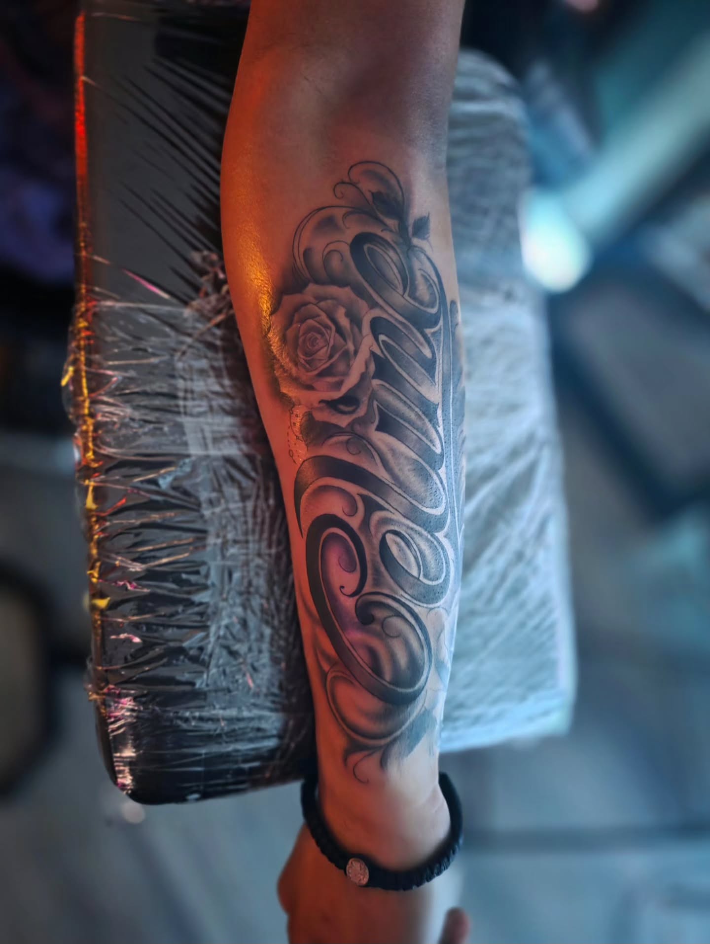 Rose and script realism tattoo on the forearm by Luke Jordan Ink, Louisville, Colorado