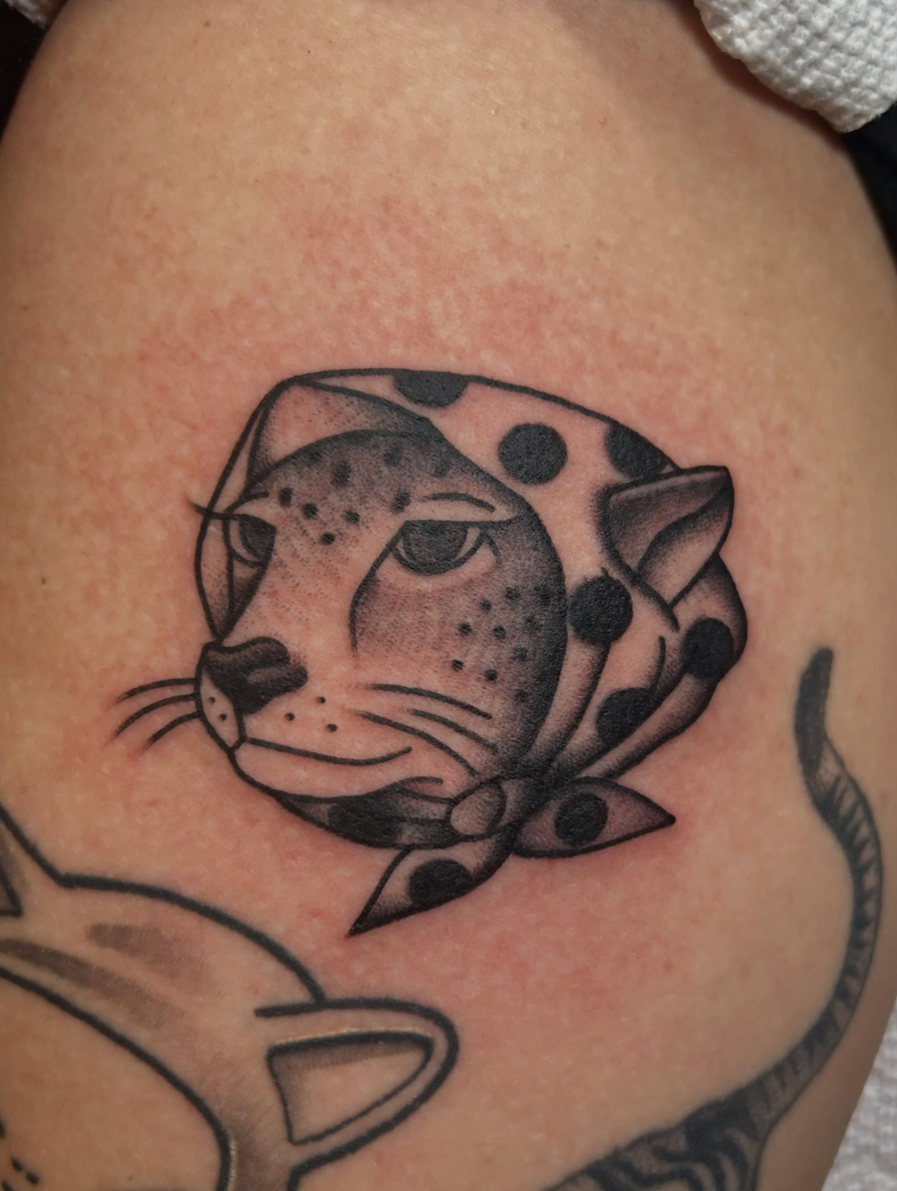 Jaguar head dotwork tattoo on the shoulder by Kelsey Lyons