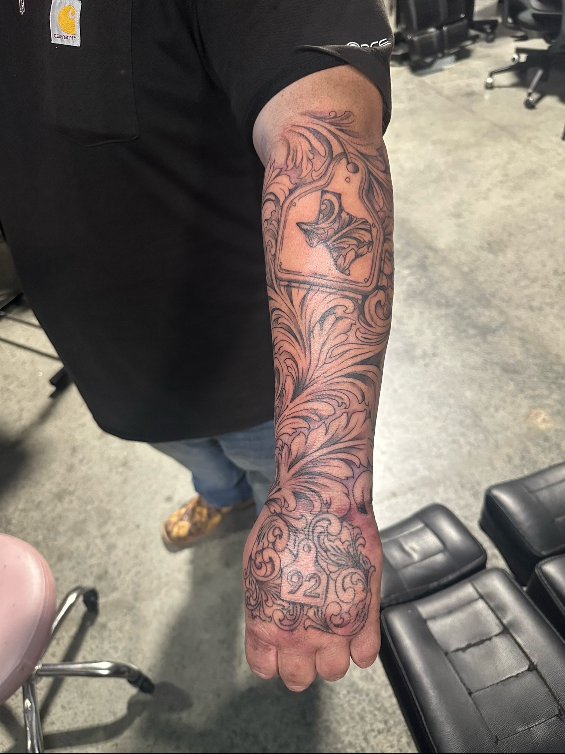 Floral design ornamental tattoo on the forearm by Elizabeth’s Eclectic Tattoos