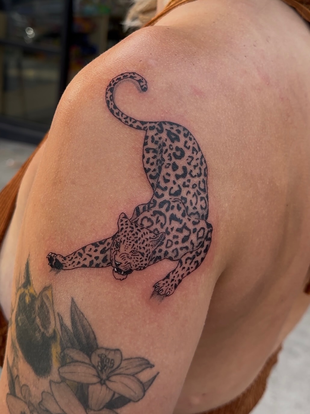 Leopard black and grey tattoo on the shoulder by Cherry Tats🍒