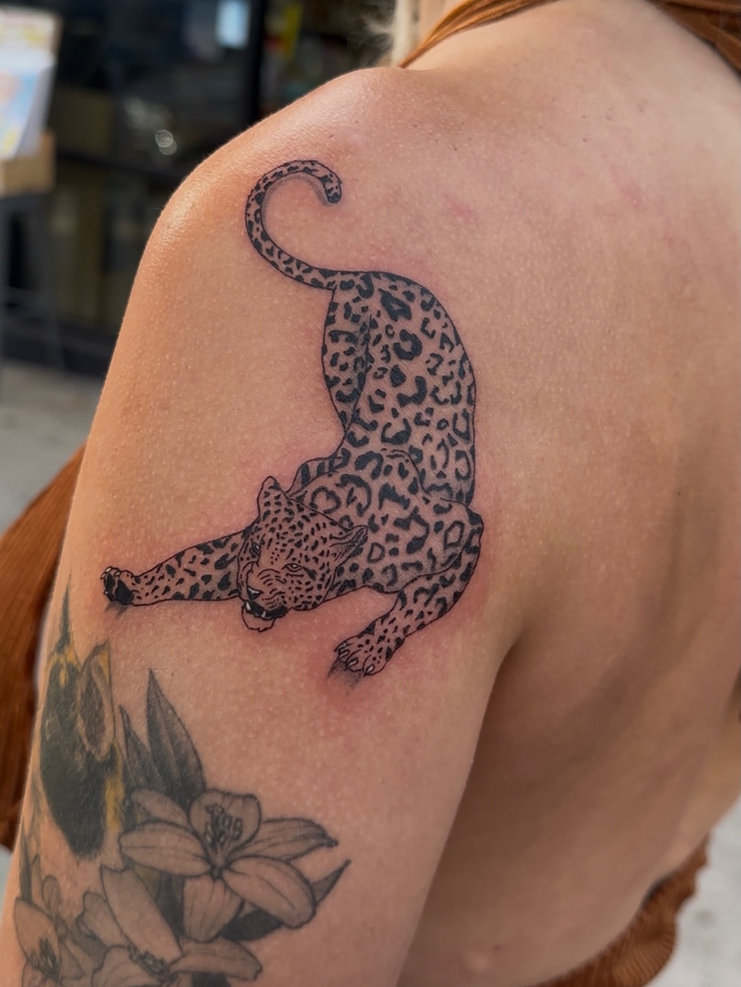 Leopard black and grey tattoo on the shoulder by Cherry Tats🍒