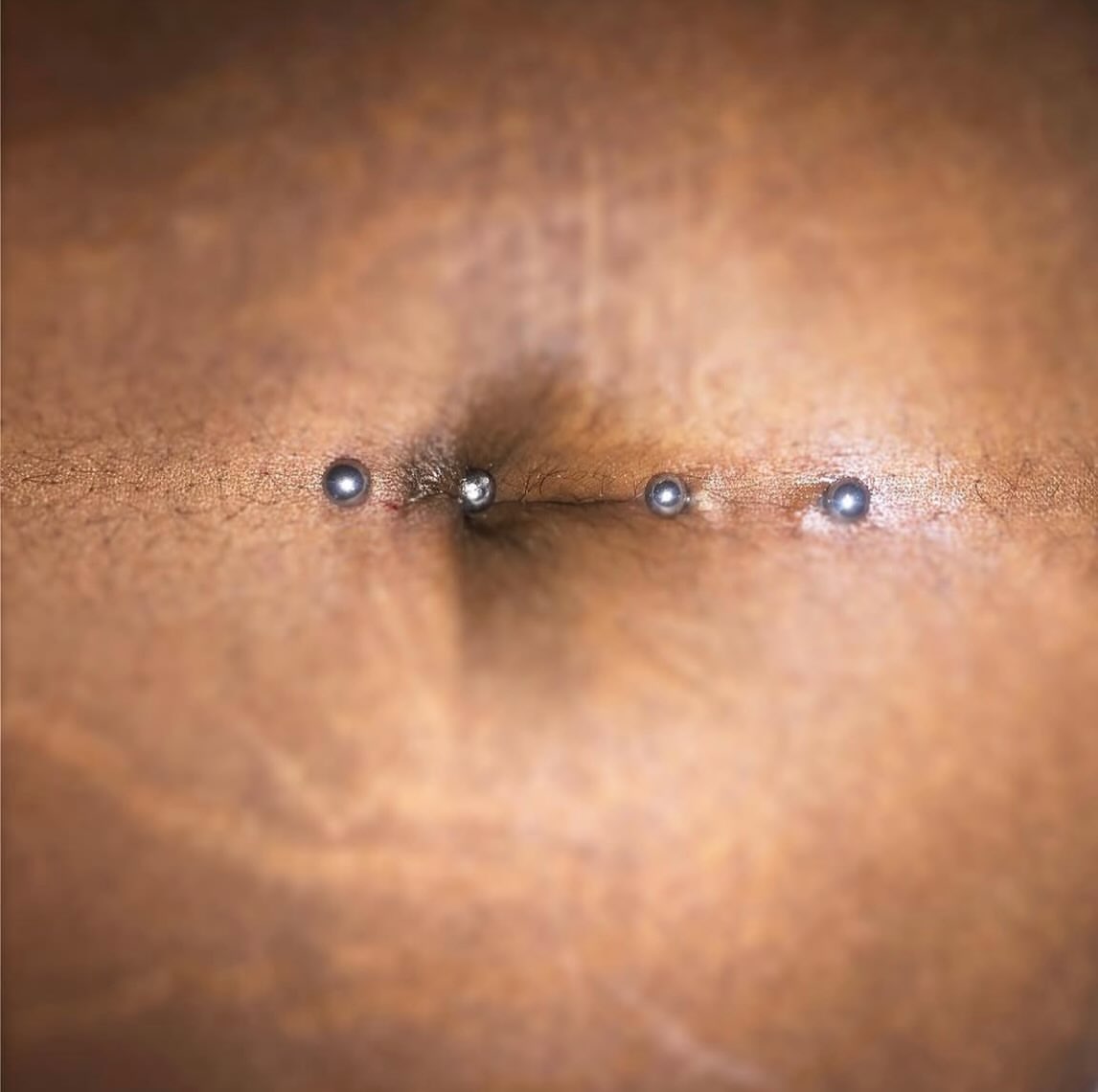 Nipple piercing black and grey tattoo on the chest by Vrs tattoo