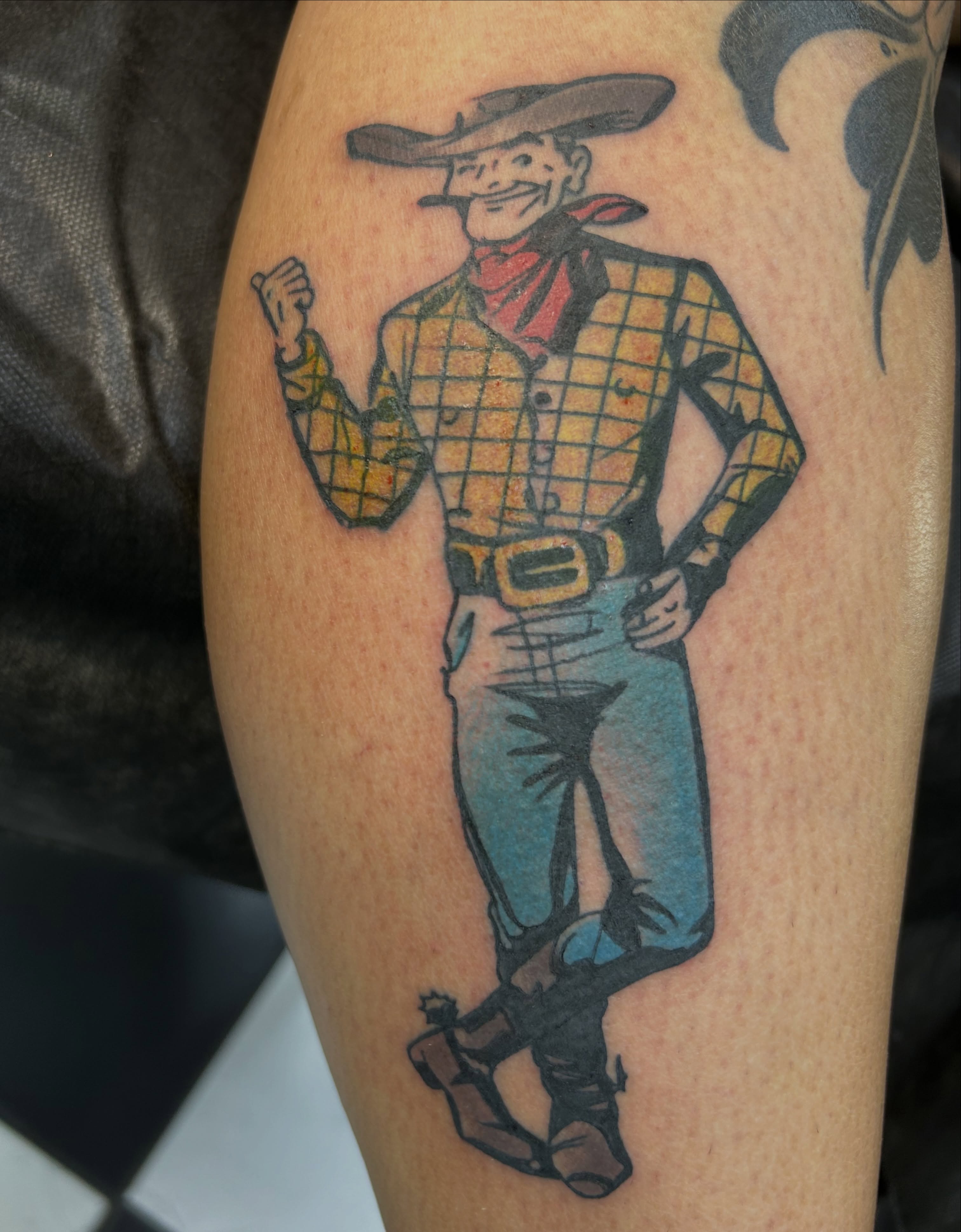 Cowboy character illustrative tattoo on the forearm by Tattoos by Corey aka MrLu