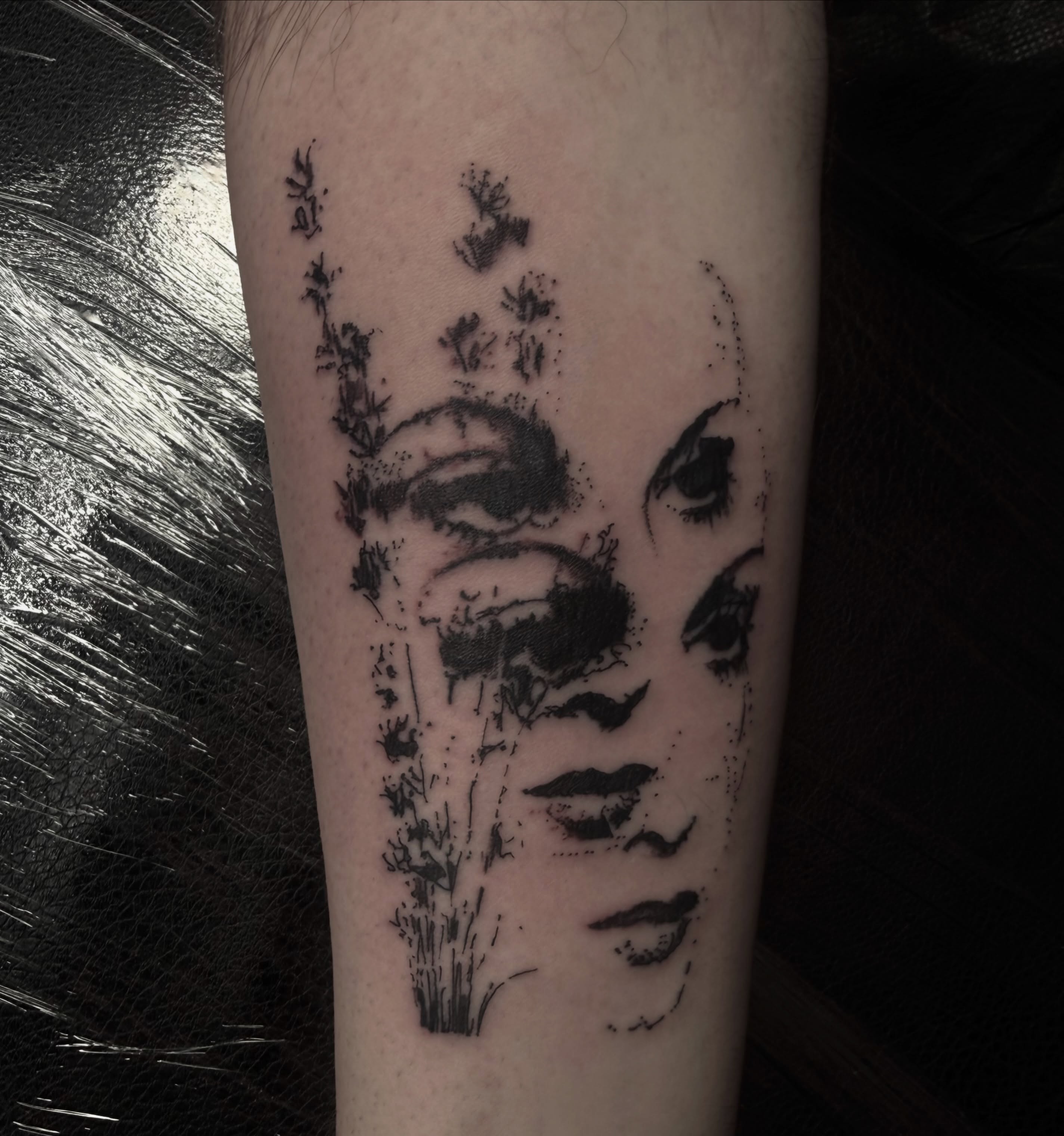 Woman's face dotwork tattoo on the forearm by Jordan Sandoval