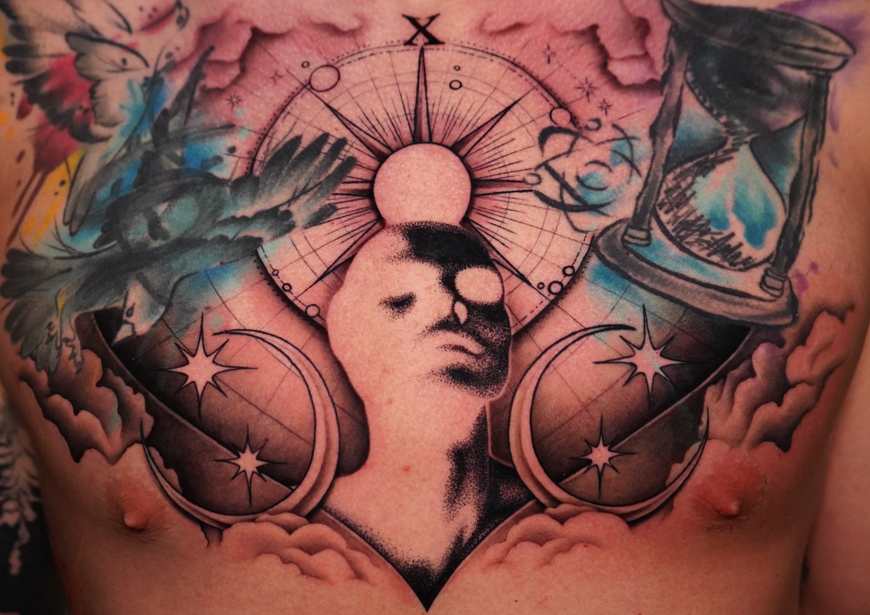 Astronomy-themed tattoo dotwork tattoo on the chest by Haley Corinne