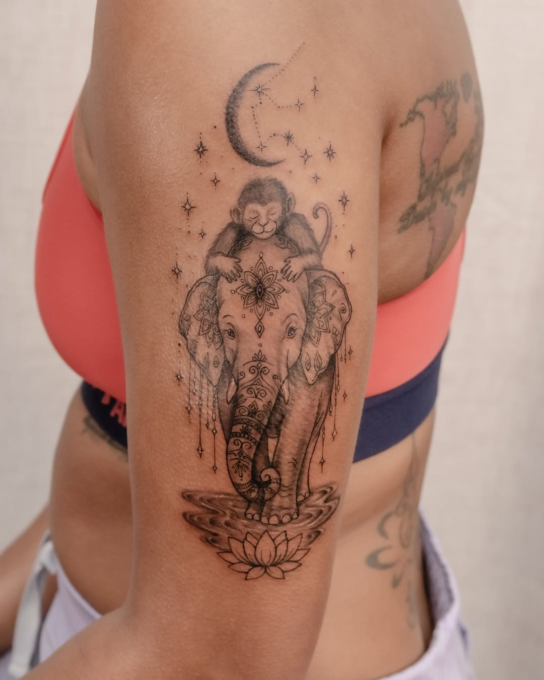Elephant and monkey dotwork tattoo on the thigh by Koko