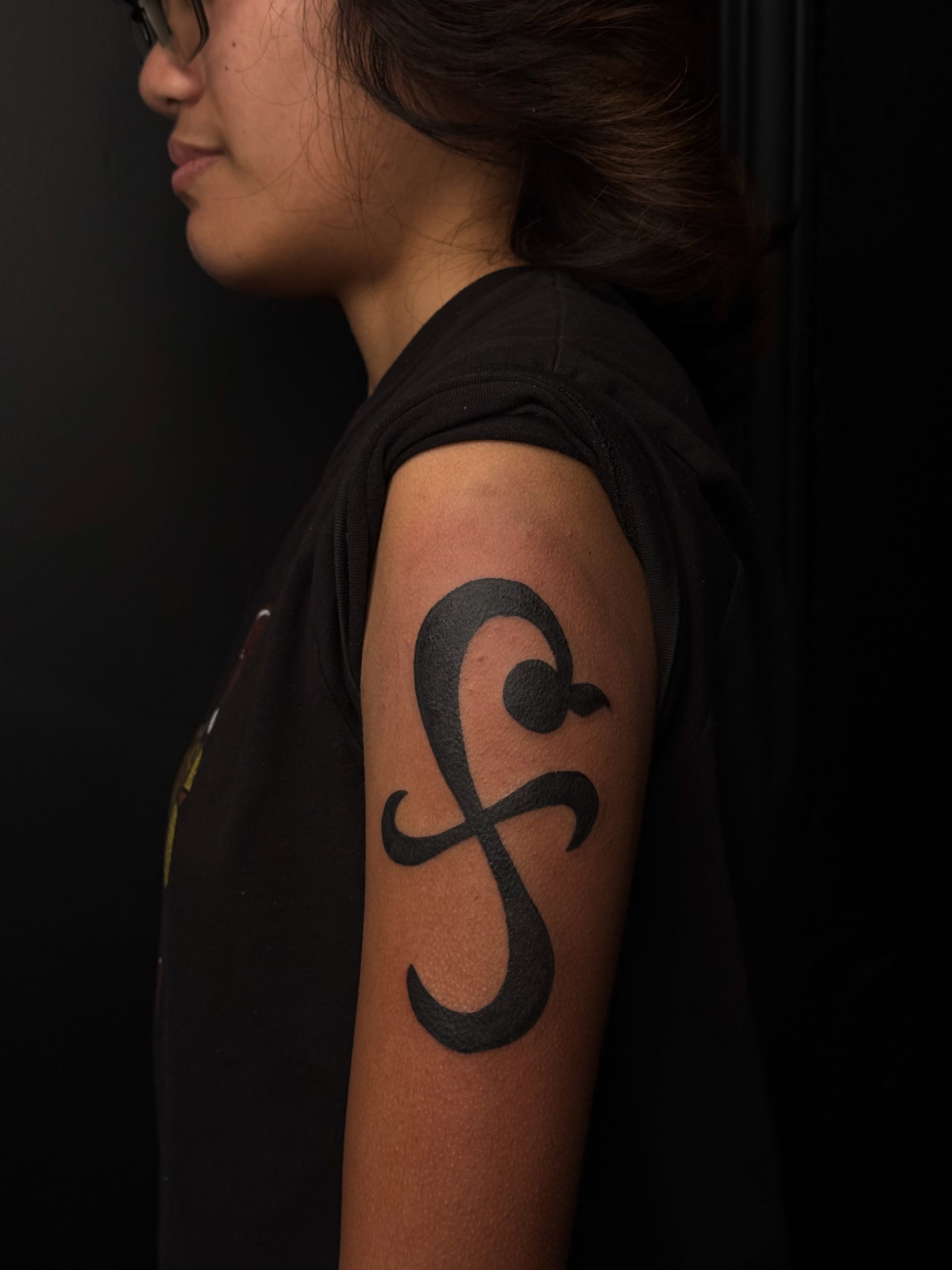 Abstract symbol black and grey tattoo on the upper arm by dewduls :), Berkeley, California