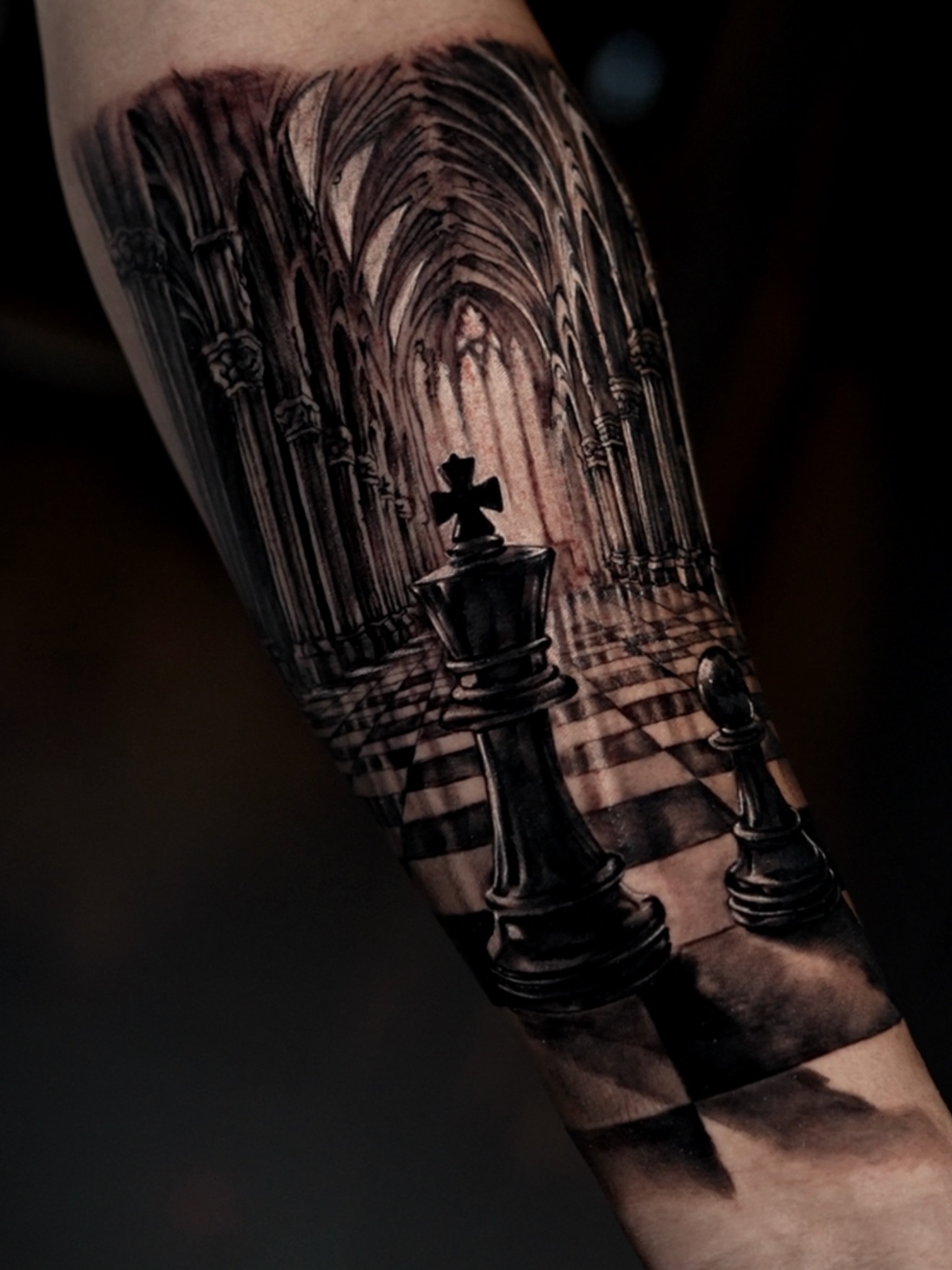 Chessboard and cathedral realism tattoo on the forearm by Alberto M