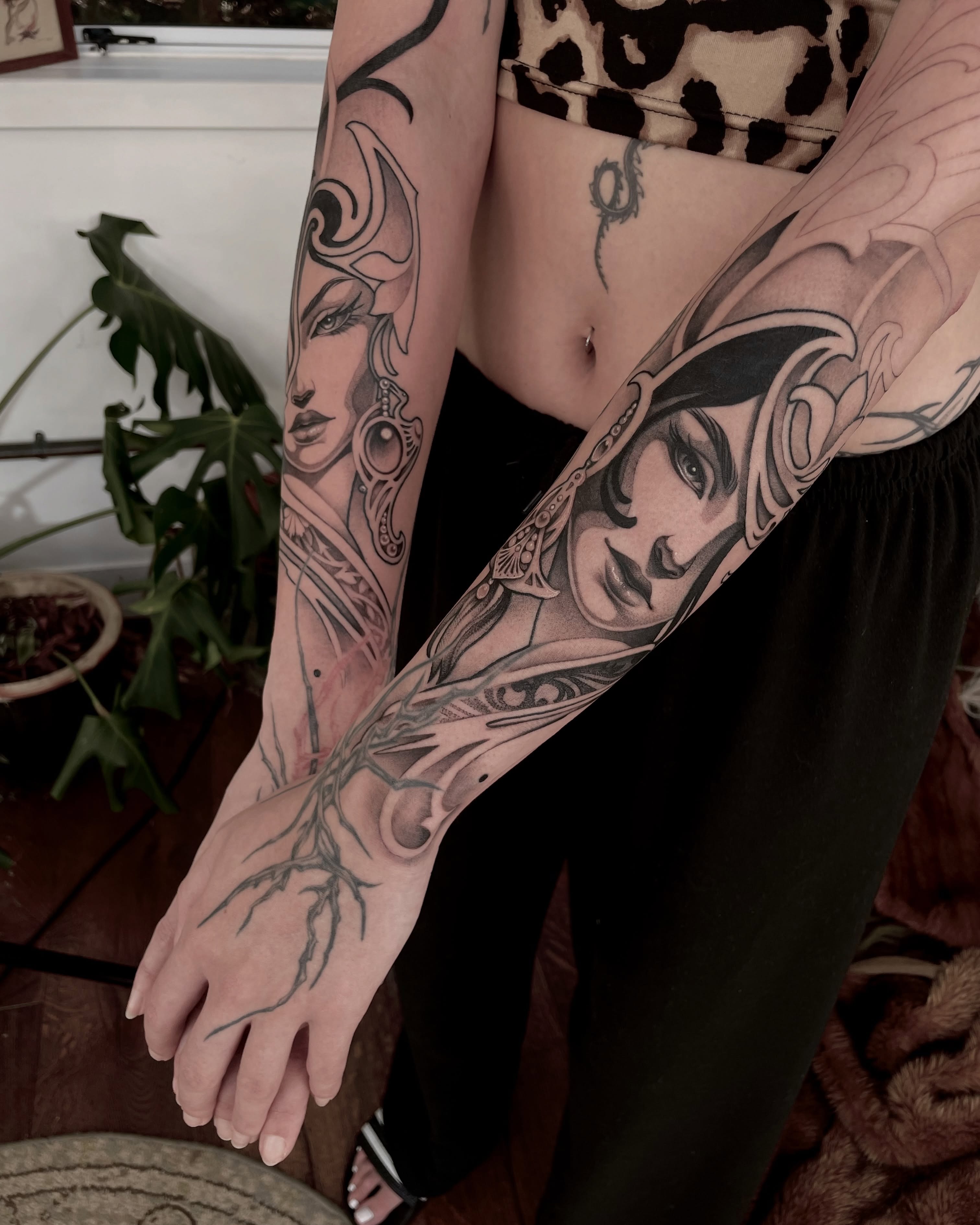 Woman's face realism tattoo on the forearm by Michelle Carlton