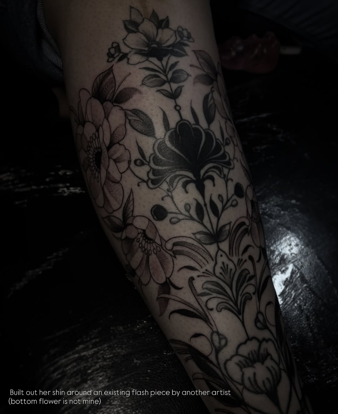 Floral pattern black and grey tattoo on the calf by Lena Lawrence