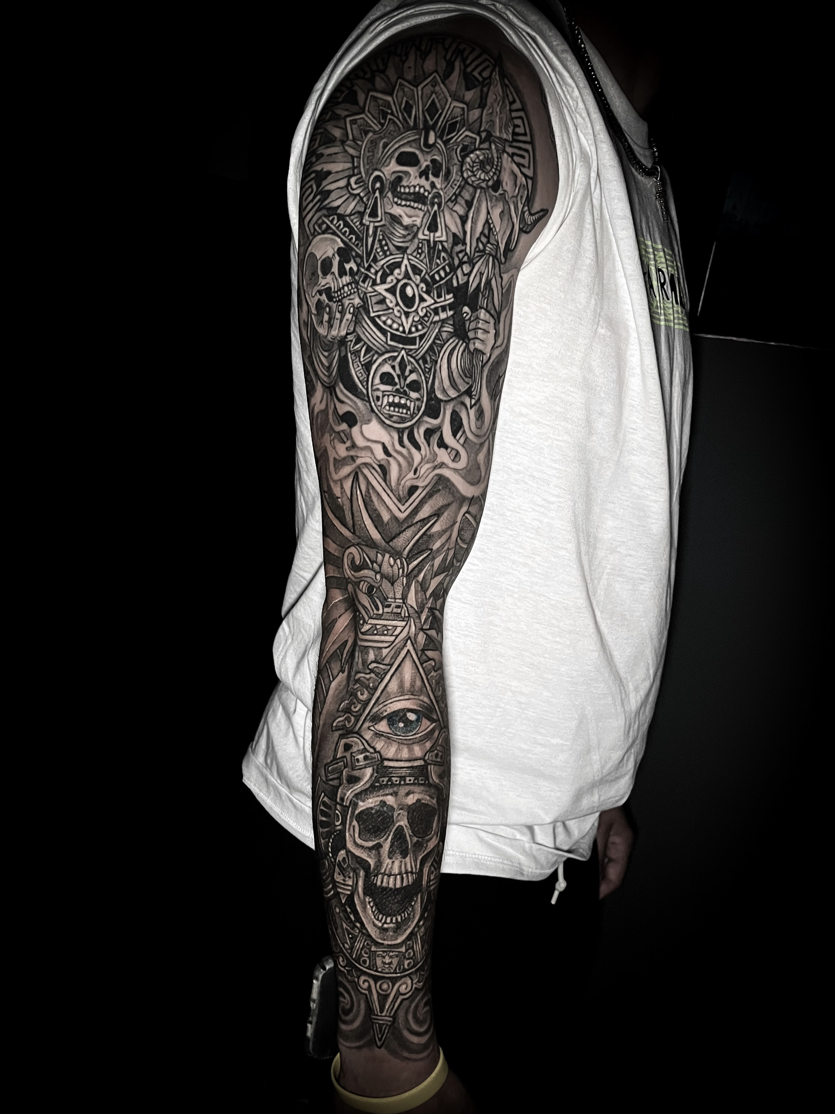 Skull and symbols geometric tattoo on the forearm by Lindsay Fernandez, Colorado Springs, Colorado