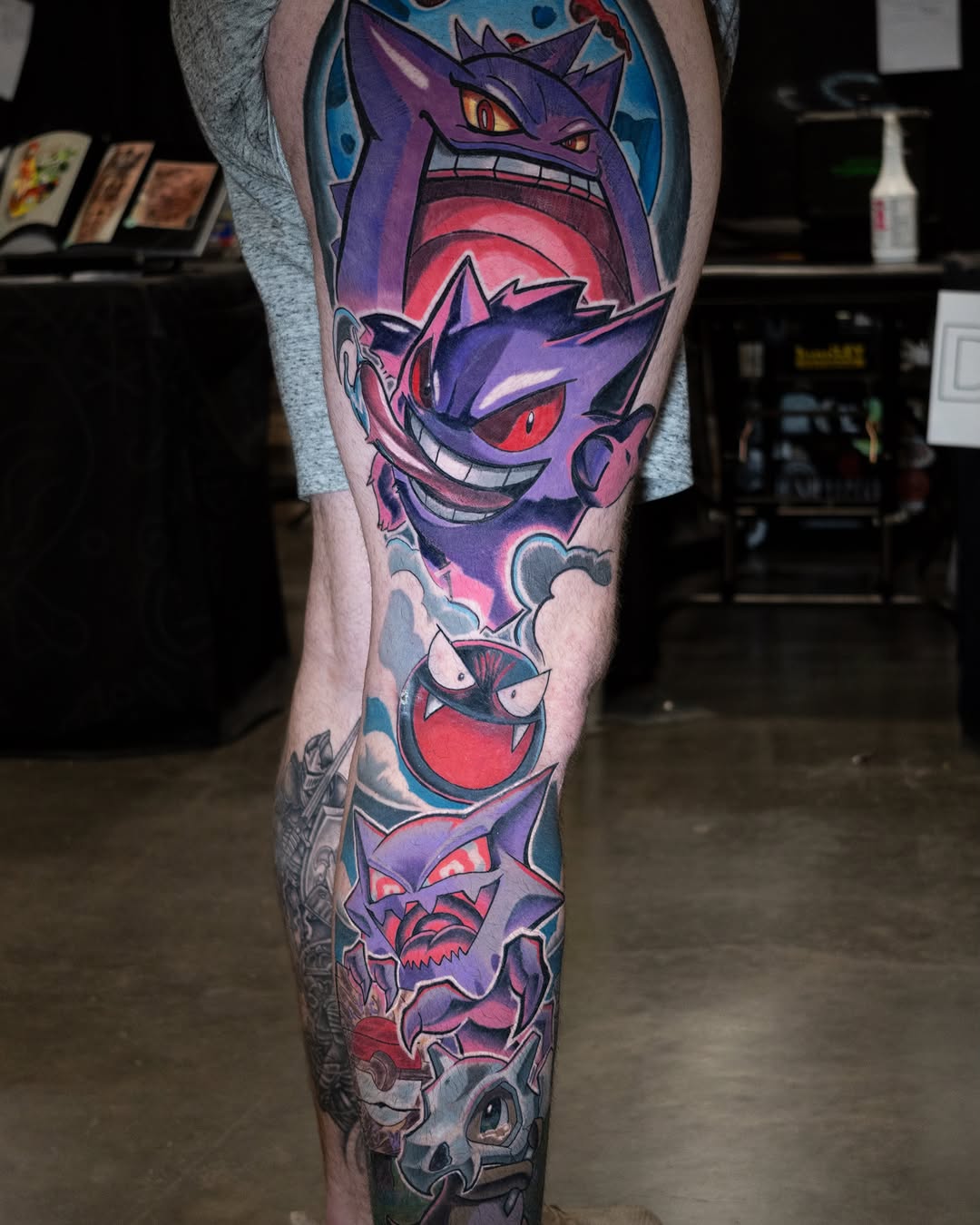 Gengar evolution line dotwork tattoo on the calf by Tracci King
