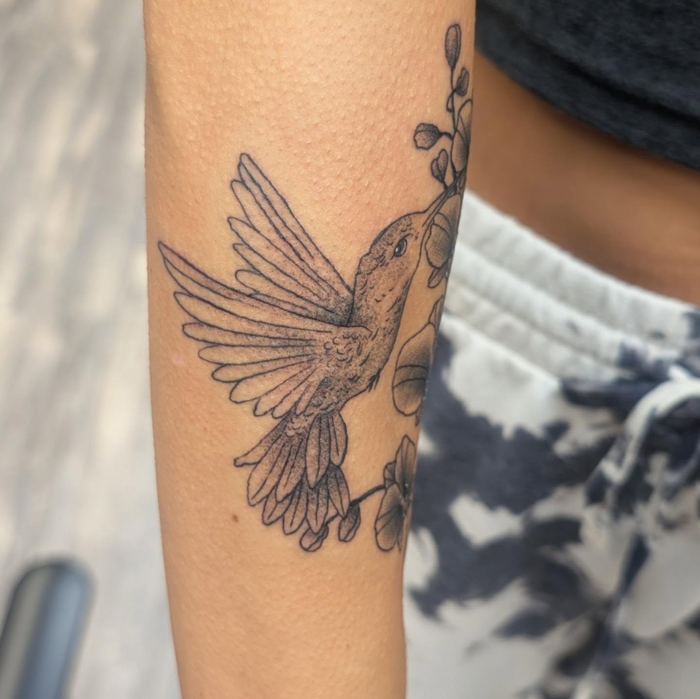 Hummingbird black and grey tattoo on the forearm by Talia Zula, Loveland, Ohio
