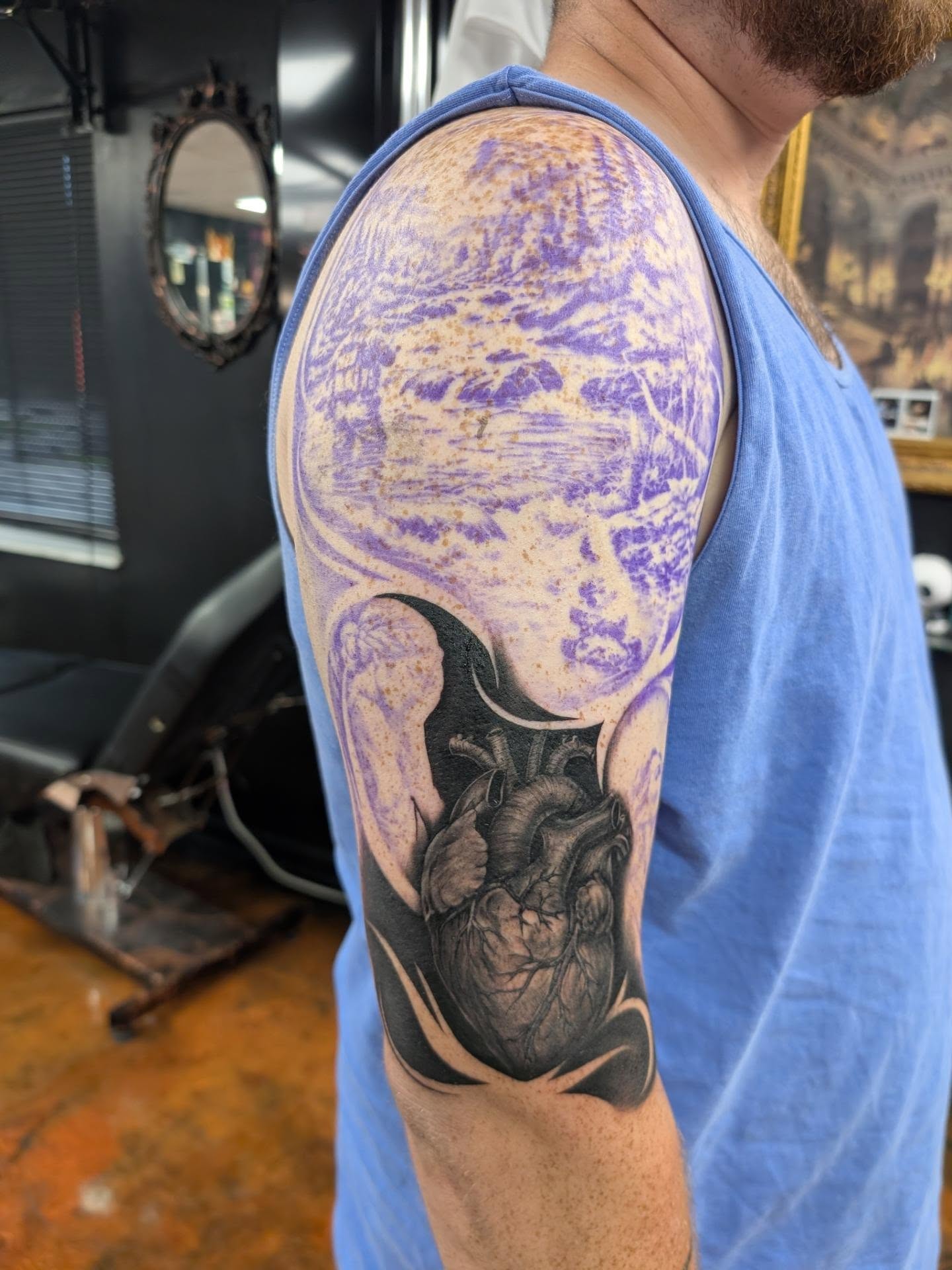Heart realism tattoo on the upper arm by Kara Falcon