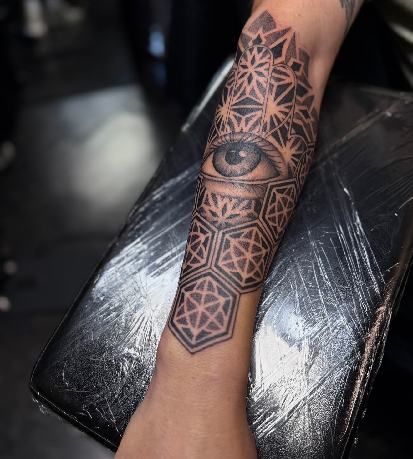 Eye and geometric patterns geometric tattoo on the forearm by Rikky Bobby, Mesa, Arizona