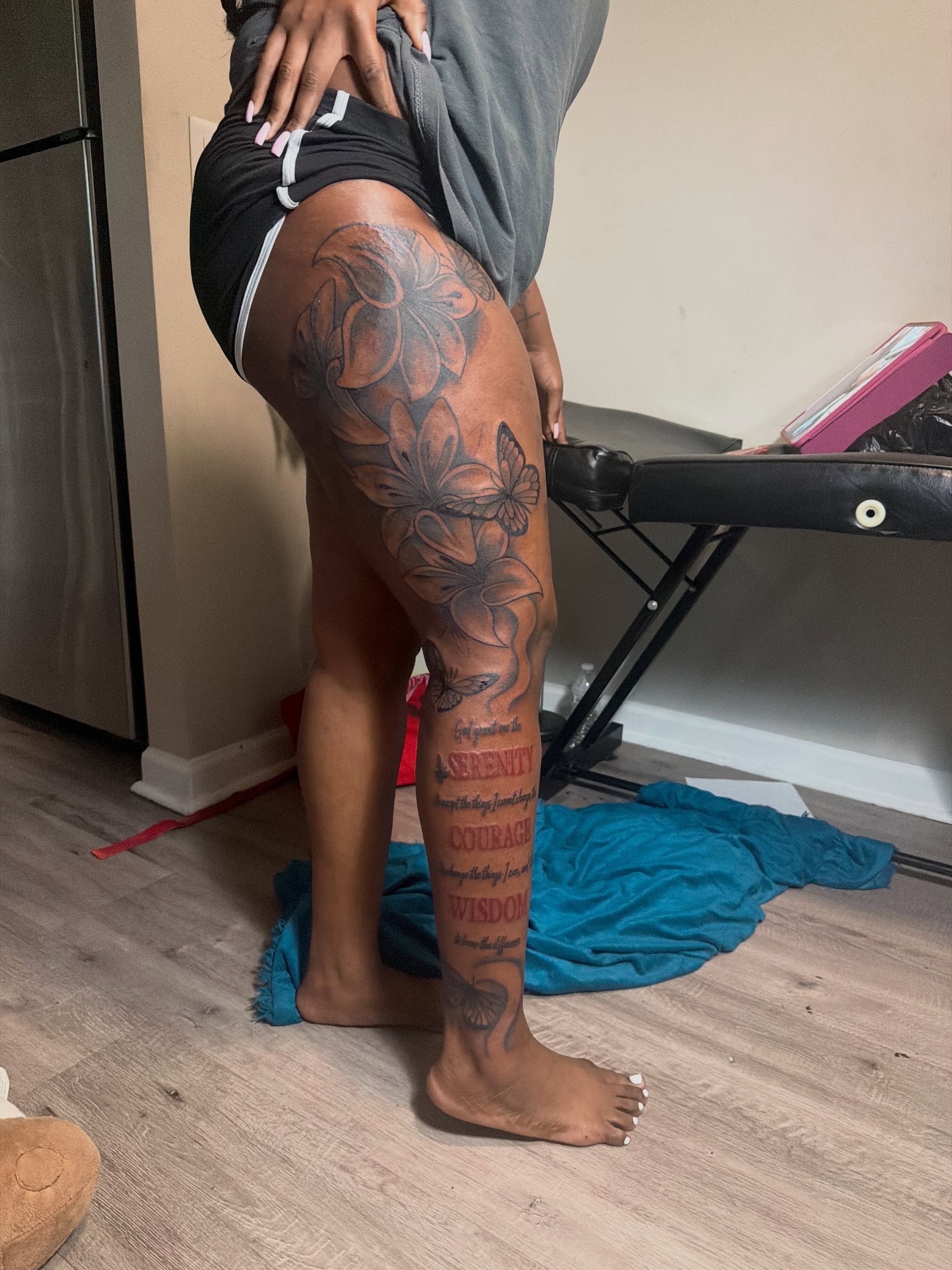 Floral design black and grey tattoo on the thigh by nylachanel