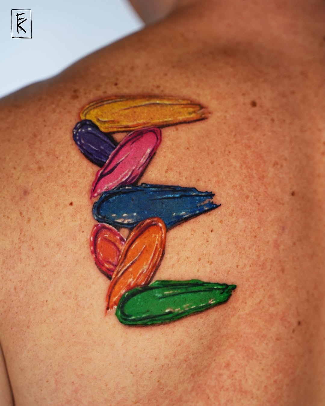Brush strokes new school tattoo on the shoulder by elizaveta