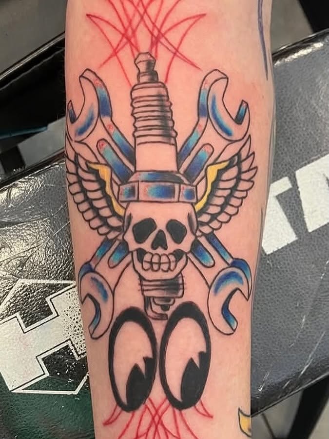 Spark plug with wings American traditional tattoo on the forearm by Bryant Johnson
