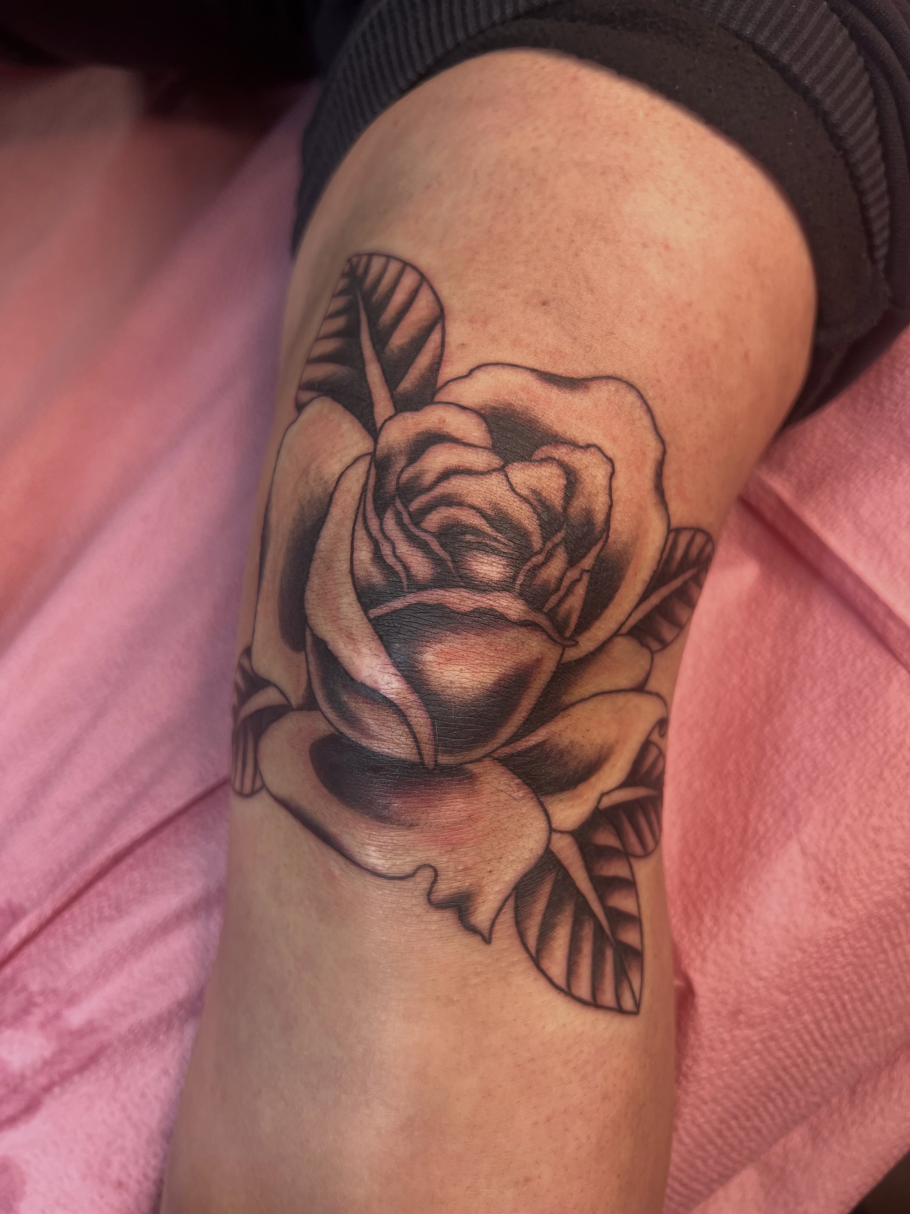 Rose black and grey tattoo on the forearm by Emily Queen