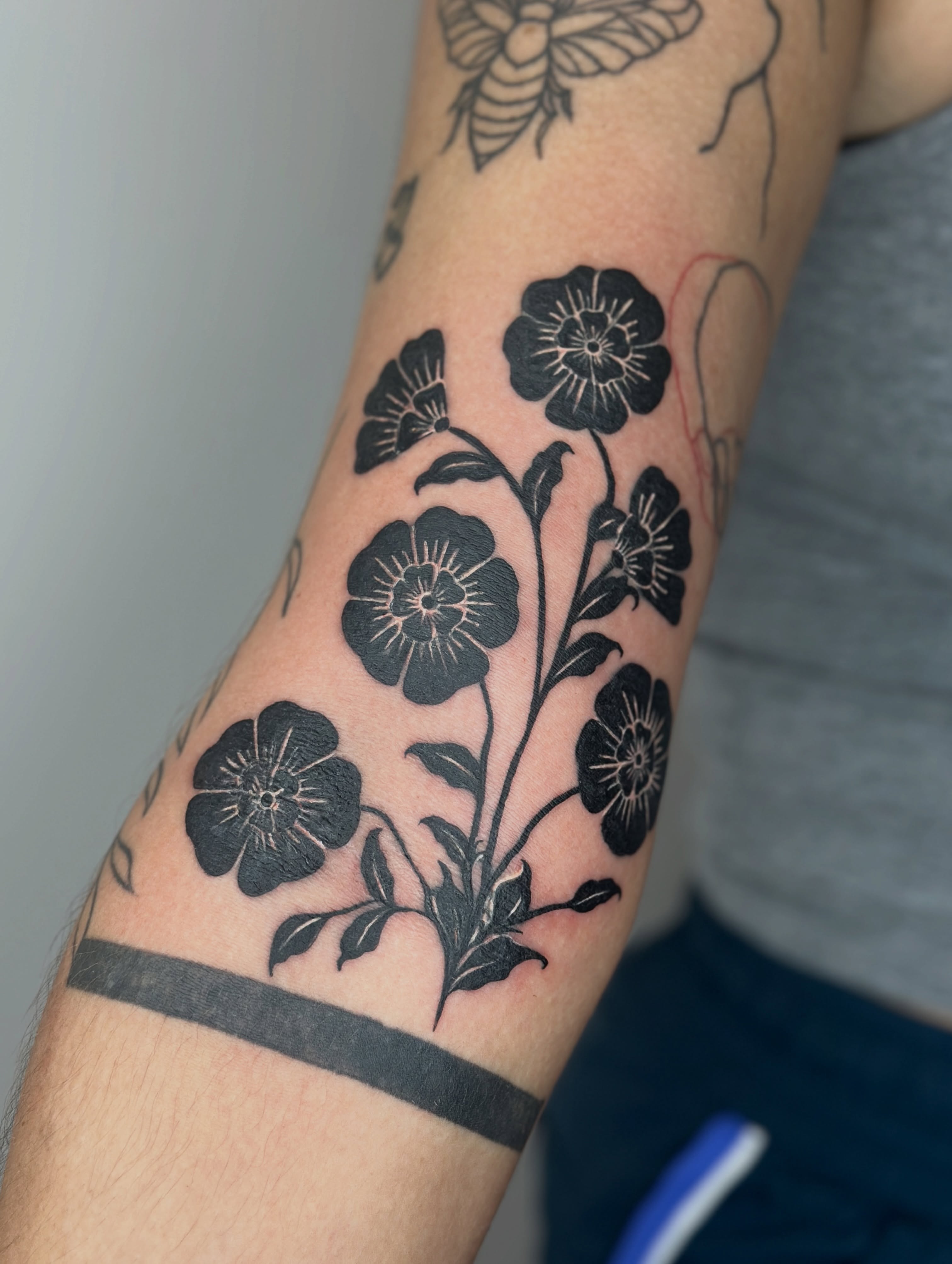 Flowers black and grey tattoo on the forearm by Gabrielle Brodman 🎀 Raleigh-Durham Tattoo