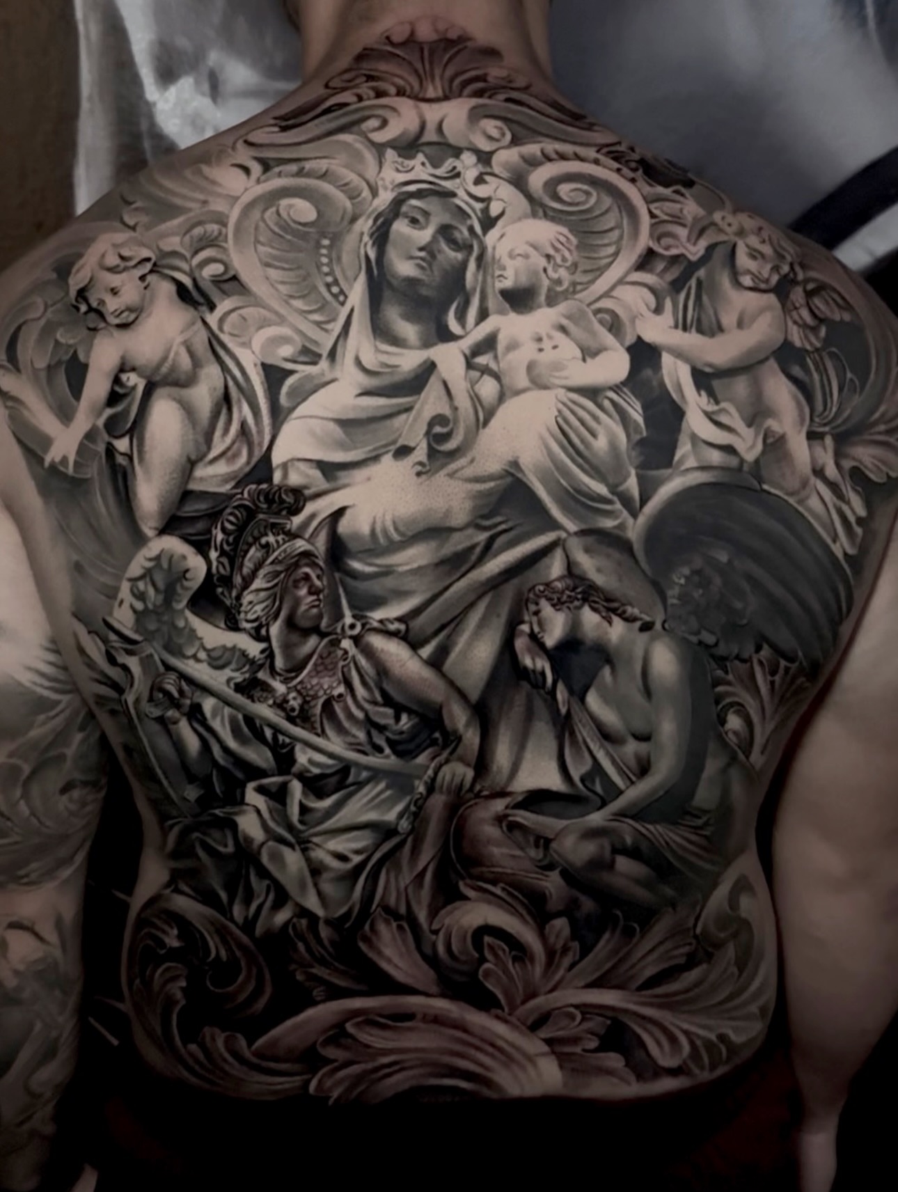Religious scene realism tattoo on the back by Yudel